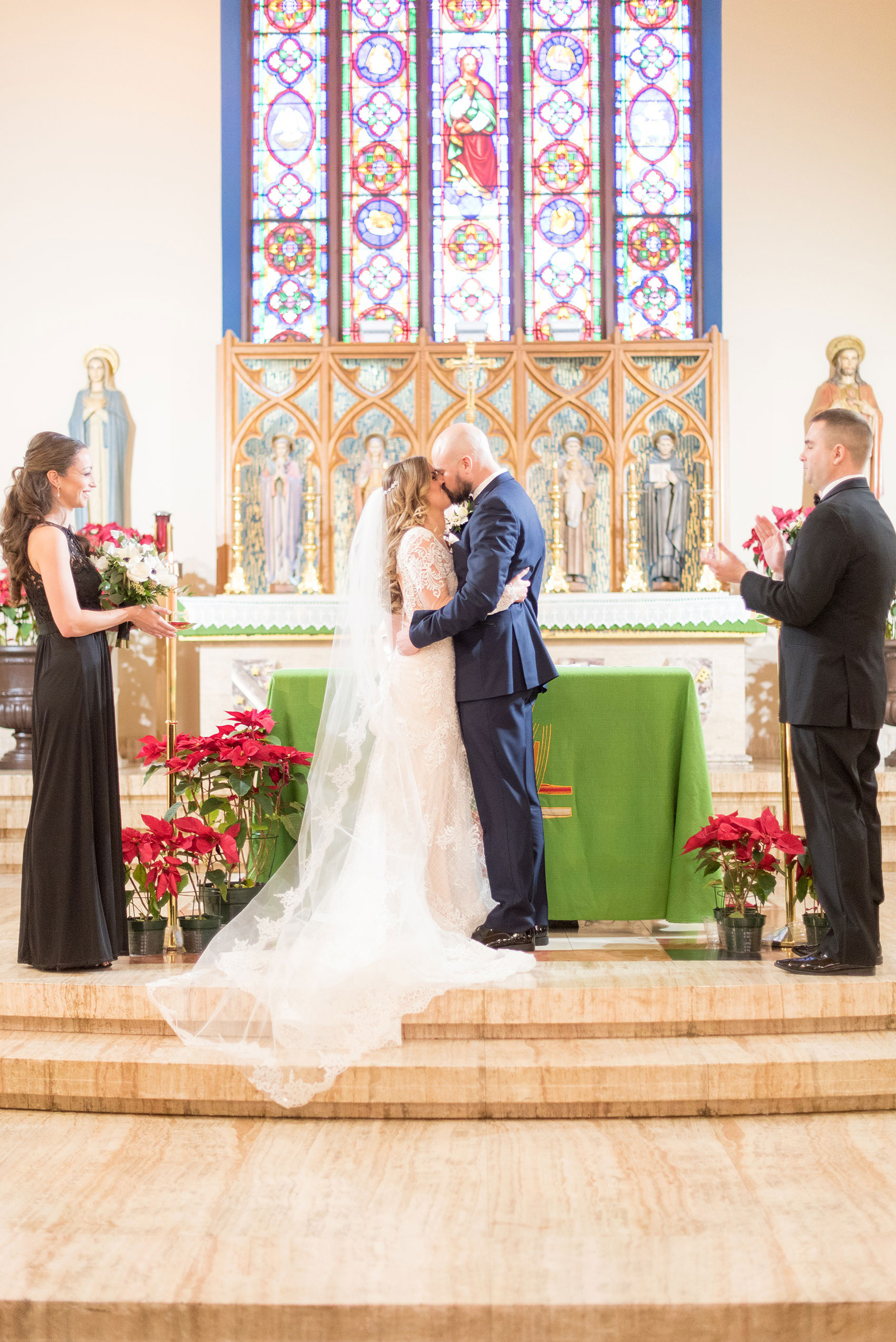 a picture of the bride and grooms first kiss as husband and