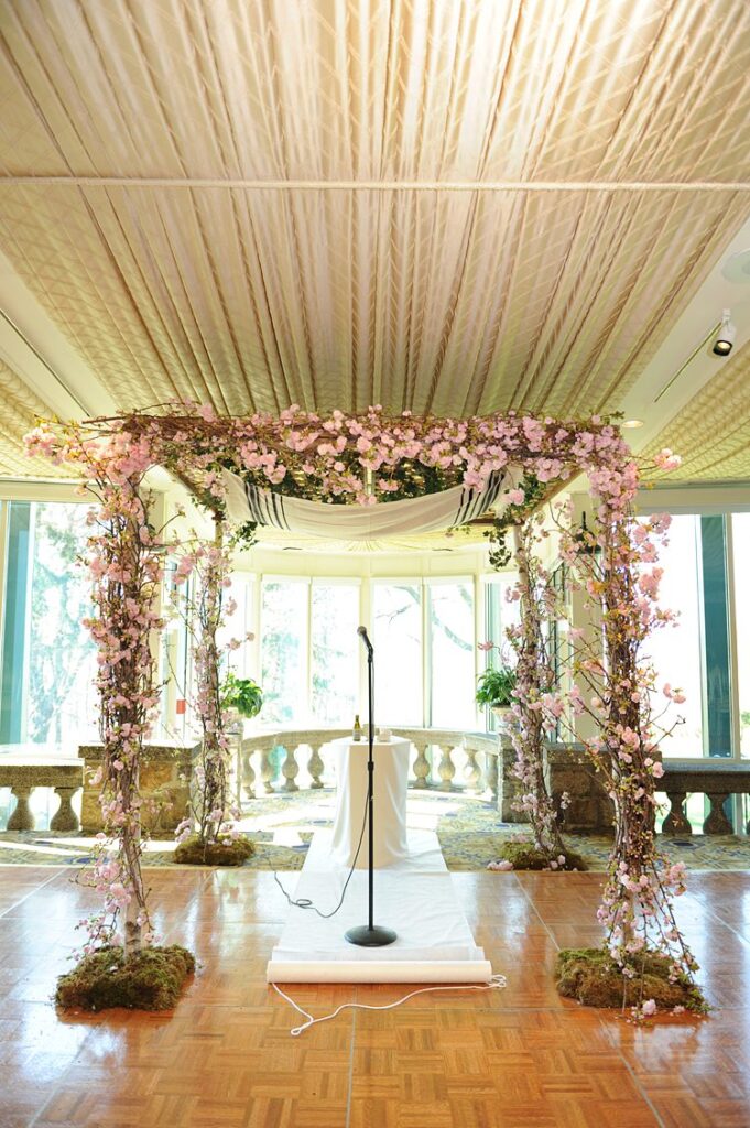 Cherry blossom decorated chuppah for a spring ceremony at Tappan Hill Mansion in Tarrytown.
