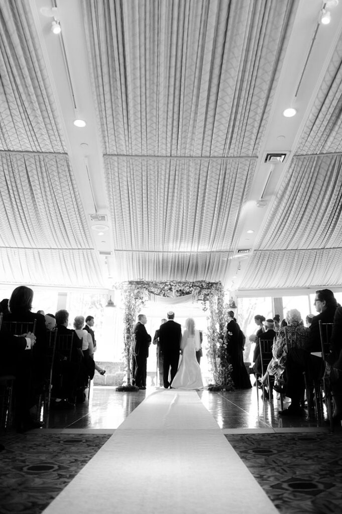 Bride and groom under a chuppah during their Jewish ceremony at Tappan Hill Mansion.