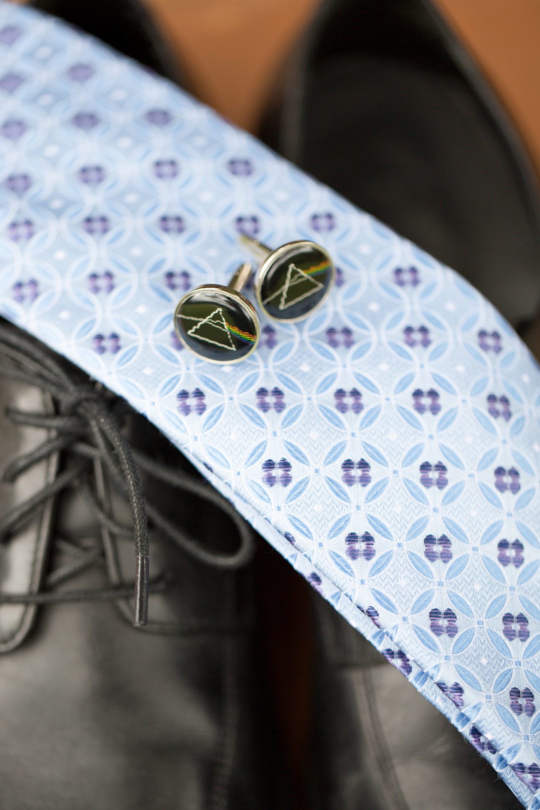 The groom wore Pink Floyd cufflinks for a music-centric wedding in the woods at Camp Getaway in Kent, CT. This summer camp wedding venue is close to NYC. Photographed by Mikkel Paige Photography. 