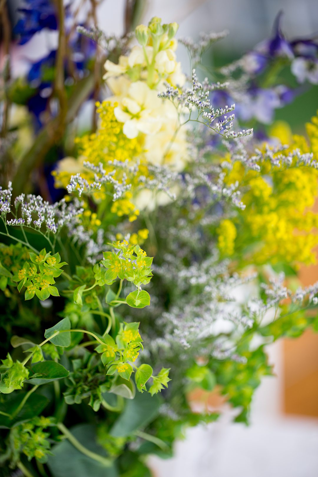 Wildflowers at the reception of a Club Getaway. The summer camp wedding was photographed by Mikkel Paige Photography.