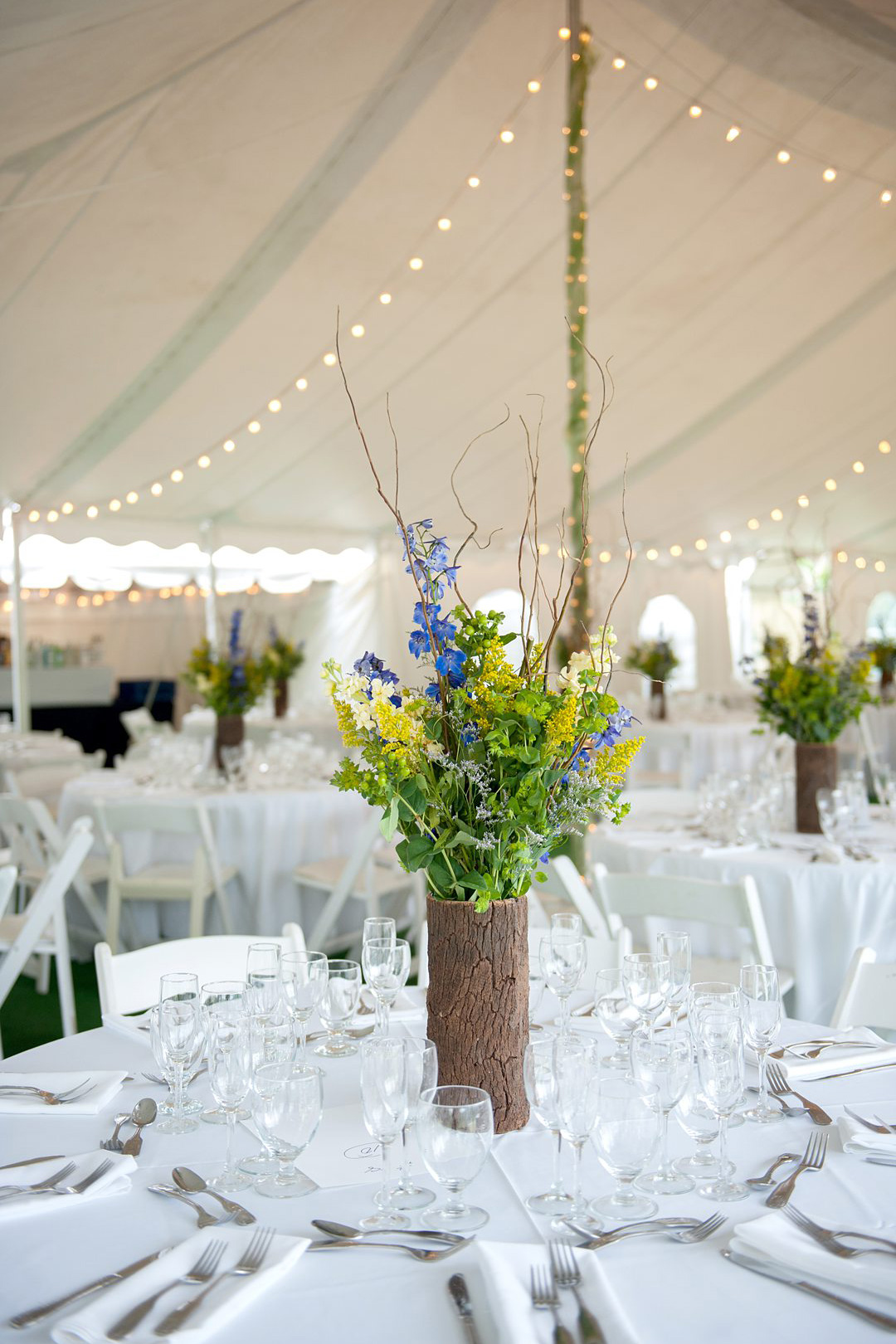 Wildflowers at the reception of a Club Getaway. The summer camp wedding was photographed by Mikkel Paige Photography.