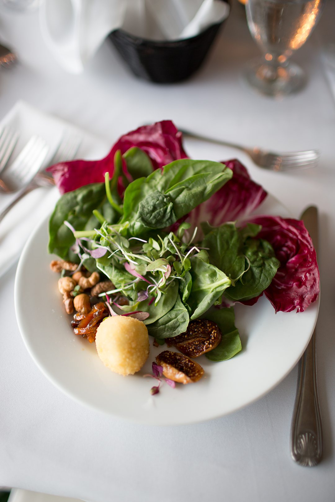 A crisp salad at the reception of a Club Getaway. The summer camp wedding was photographed by Mikkel Paige Photography.