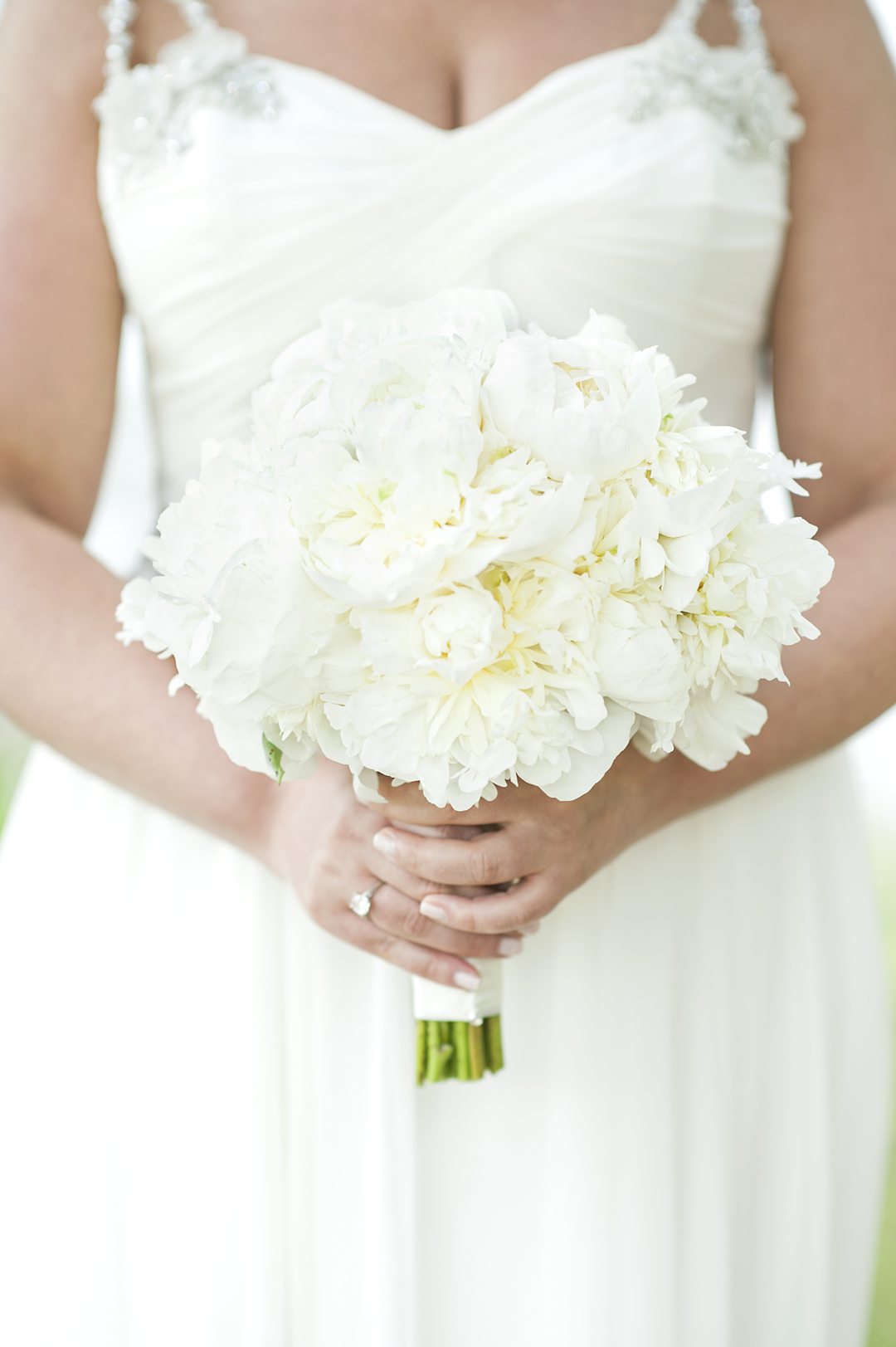 An all white peony bouquet photographed by luxury wedding photographer Mikkel Paige Photography for a wedding at Club Getaway.