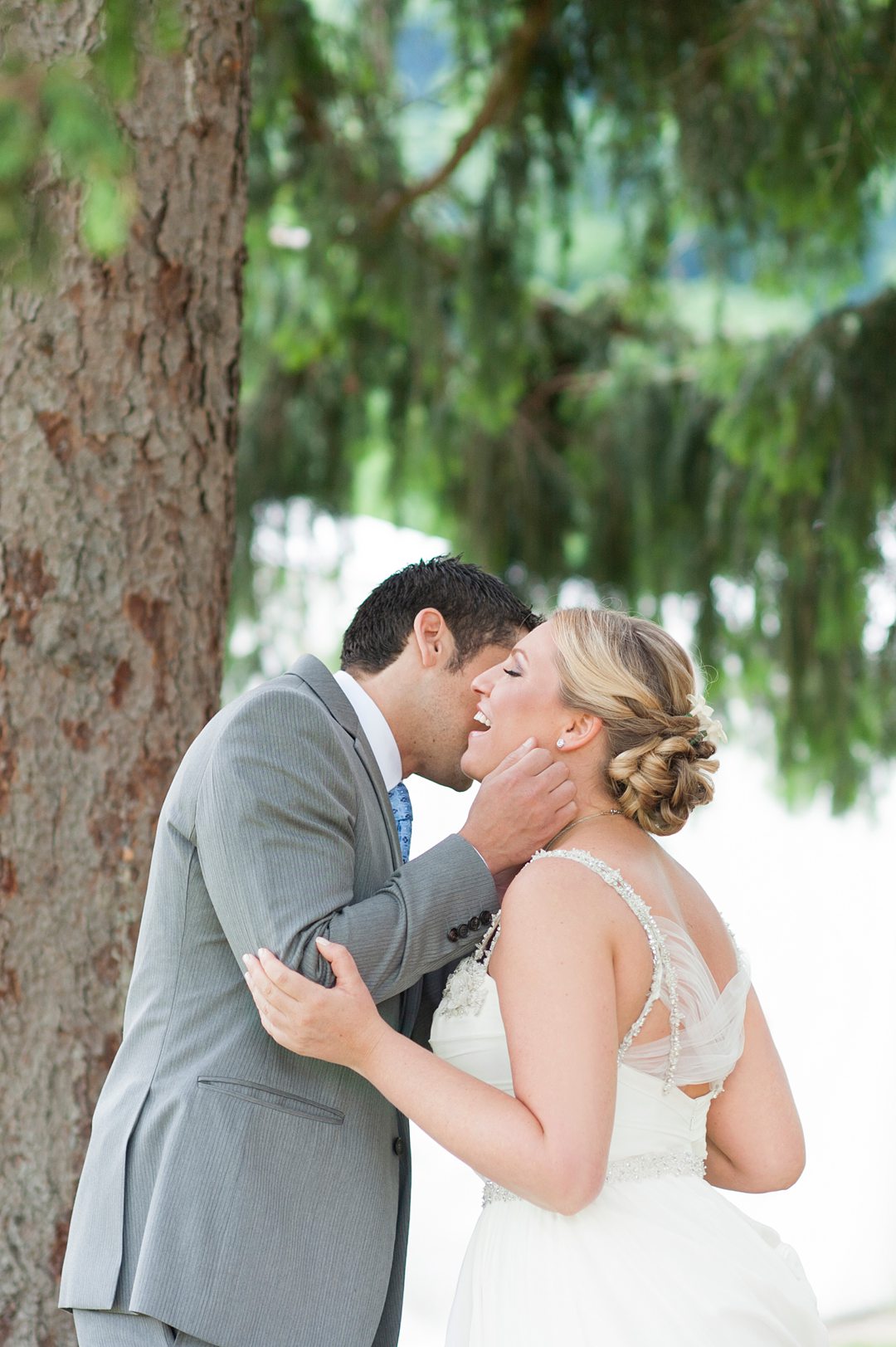 A bride in a Hayley Paige gown with a tulle criss-crock back photographed by Mikkel Paige Photography for a wedding at Camp Getaway.