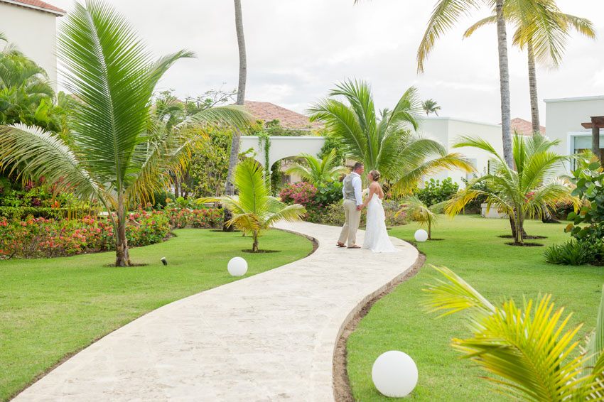 Caribbean Destination Wedding in Punta Cana, Dominican Republic at Larimar Resort. Photos by Mikkel Paige Photography. The bride and groom share a tropical moment. 