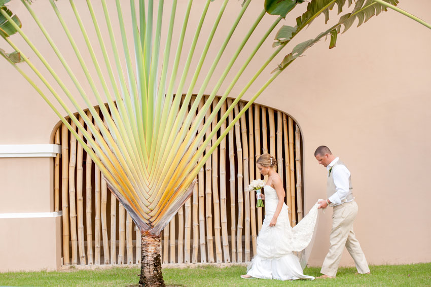 Caribbean Destination Wedding in Punta Cana, Dominican Republic at Larimar Resort. Photos by Mikkel Paige Photography. The bride and groom share a tropical moment.