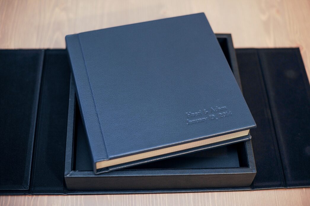 Navy blue fine art wedding album by Mikkel Paige Photography.