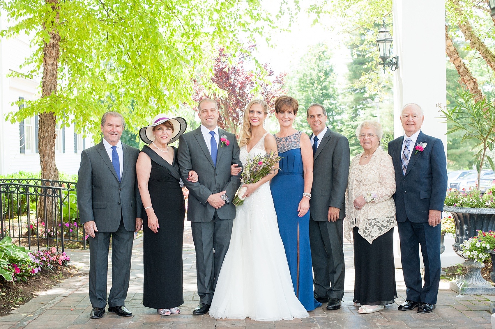 Beautiful family photo during an outdoor summer wedding in New Jersey. Photo by Mikkel Paige Photography.