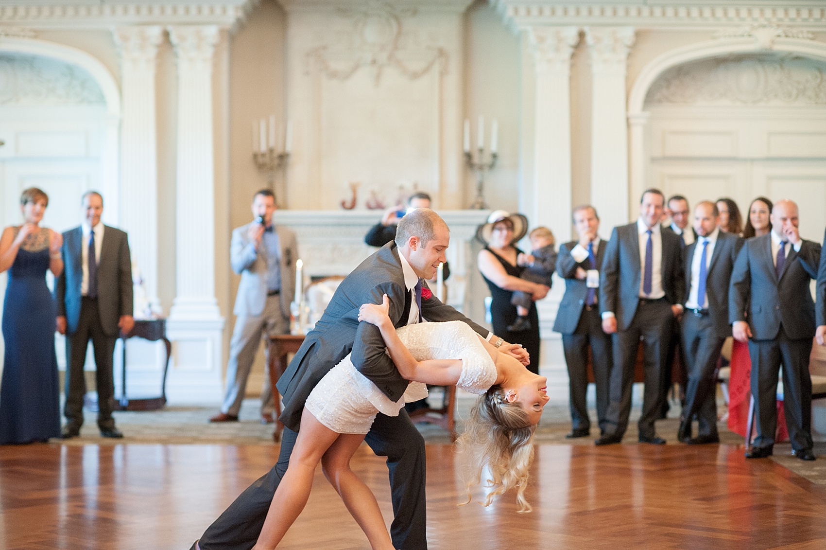 The bride and groom do a choreographed first dance complete with a grand finale dip! Photo by Mikkel Paige Photography.