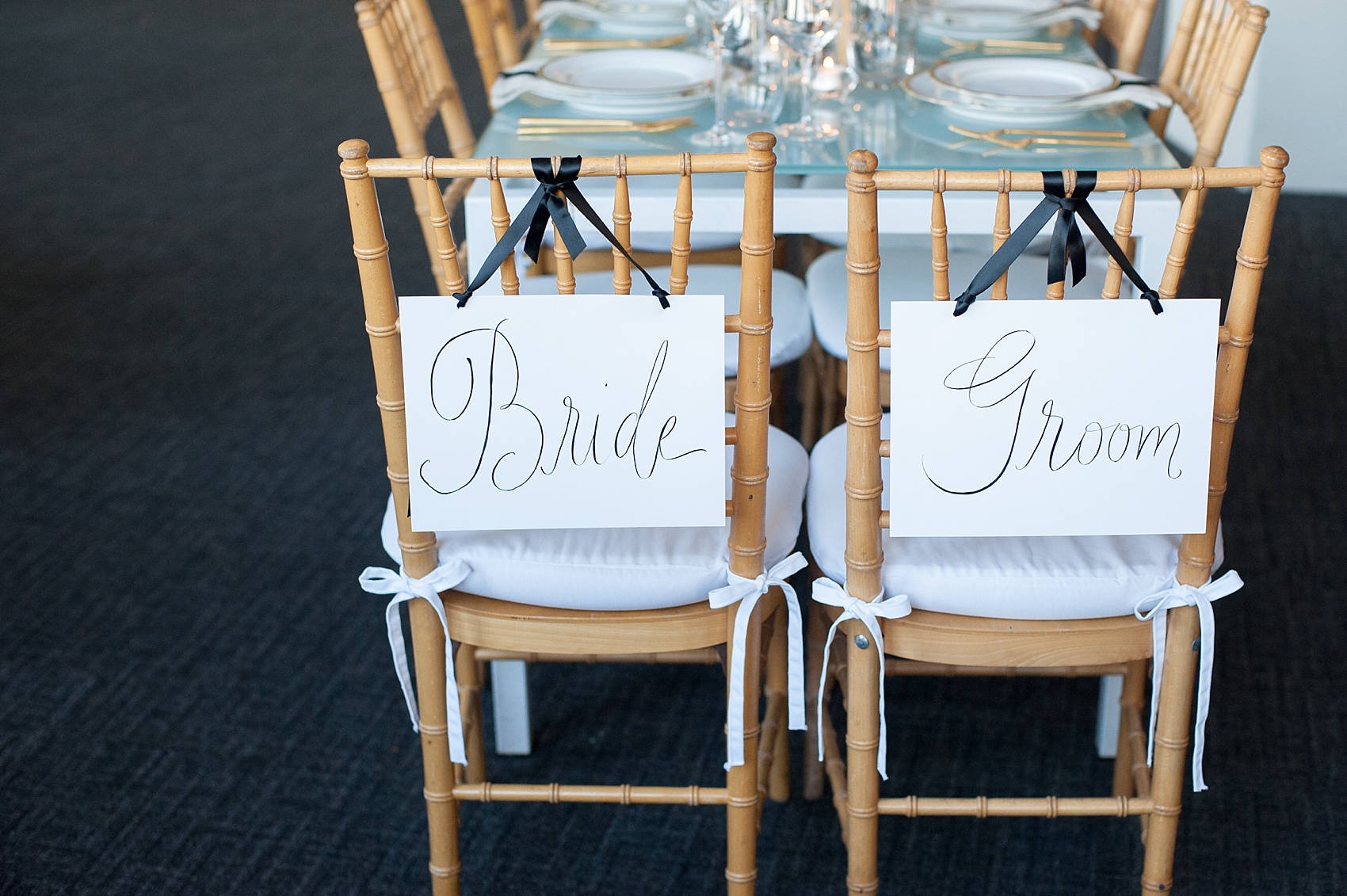 Chair signage from a black and gold wedding inspiration photo shoot in NYC. Photos by Mikkel Paige Photography.