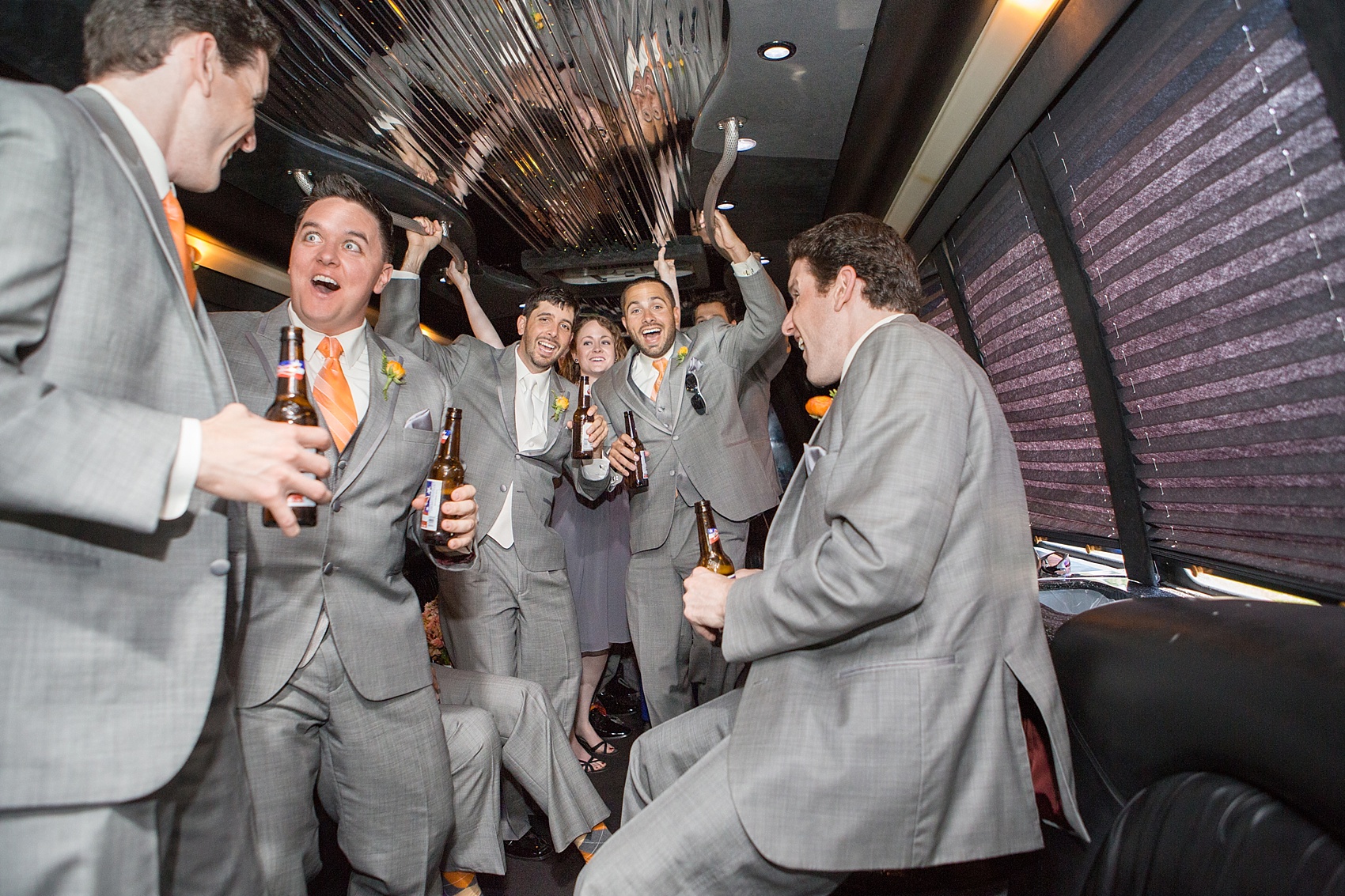 The groomsmen on a party bus to a downtown Baltimore wedding. Photos by Mikkel Paige Photography.