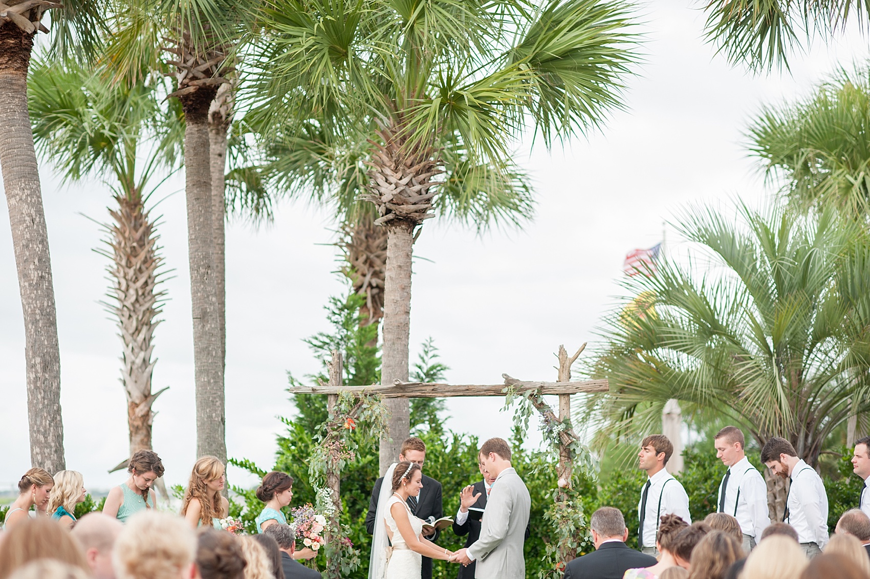 Charleston, South Carolina wedding photography. Palm tree waterfront ceremony. Images by Mikkel Paige Photography.