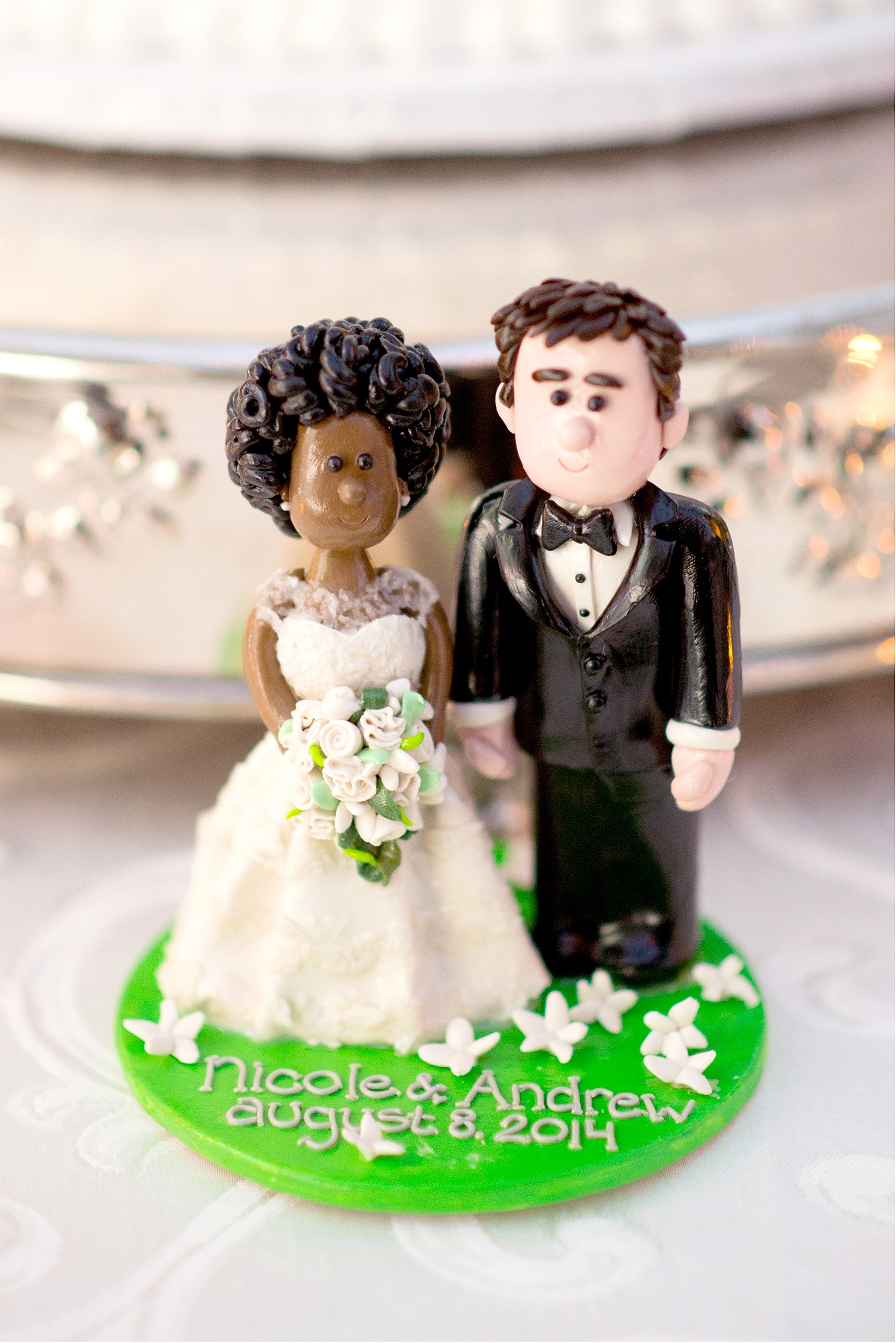 Custom cake topper resembles the bride and groom! Wedding reception at the Conservatory at The Madison Hotel, New Jersey. Photos by Mikkel Paige Photography.
