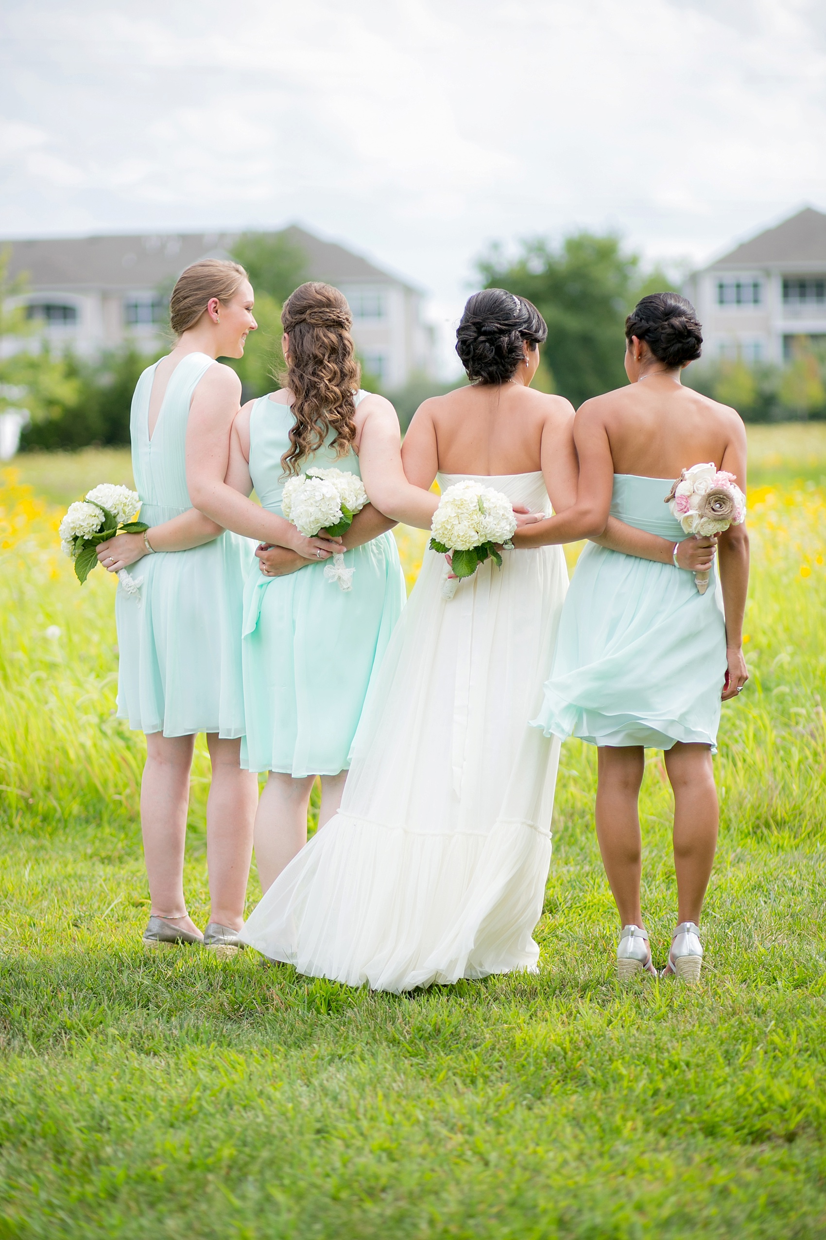 Mint green bridesmaids dresses and BHLDN wedding gown for a summer vineyard wedding at Hopewell Valley Vineyards. Photos by New Jersey wedding photographer, Mikkel Paige Photography.