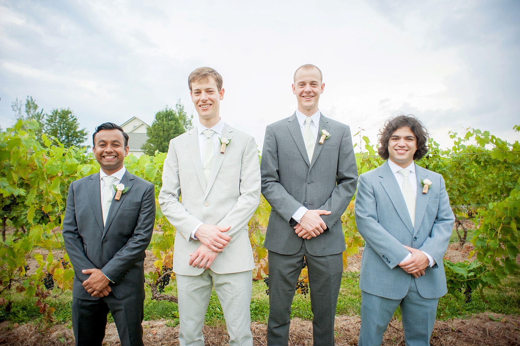 Groom in J. Crew with his groomsmen for a summer vineyard wedding at Hopewell Valley Vineyards. Photos by New Jersey wedding photographer, Mikkel Paige Photography.