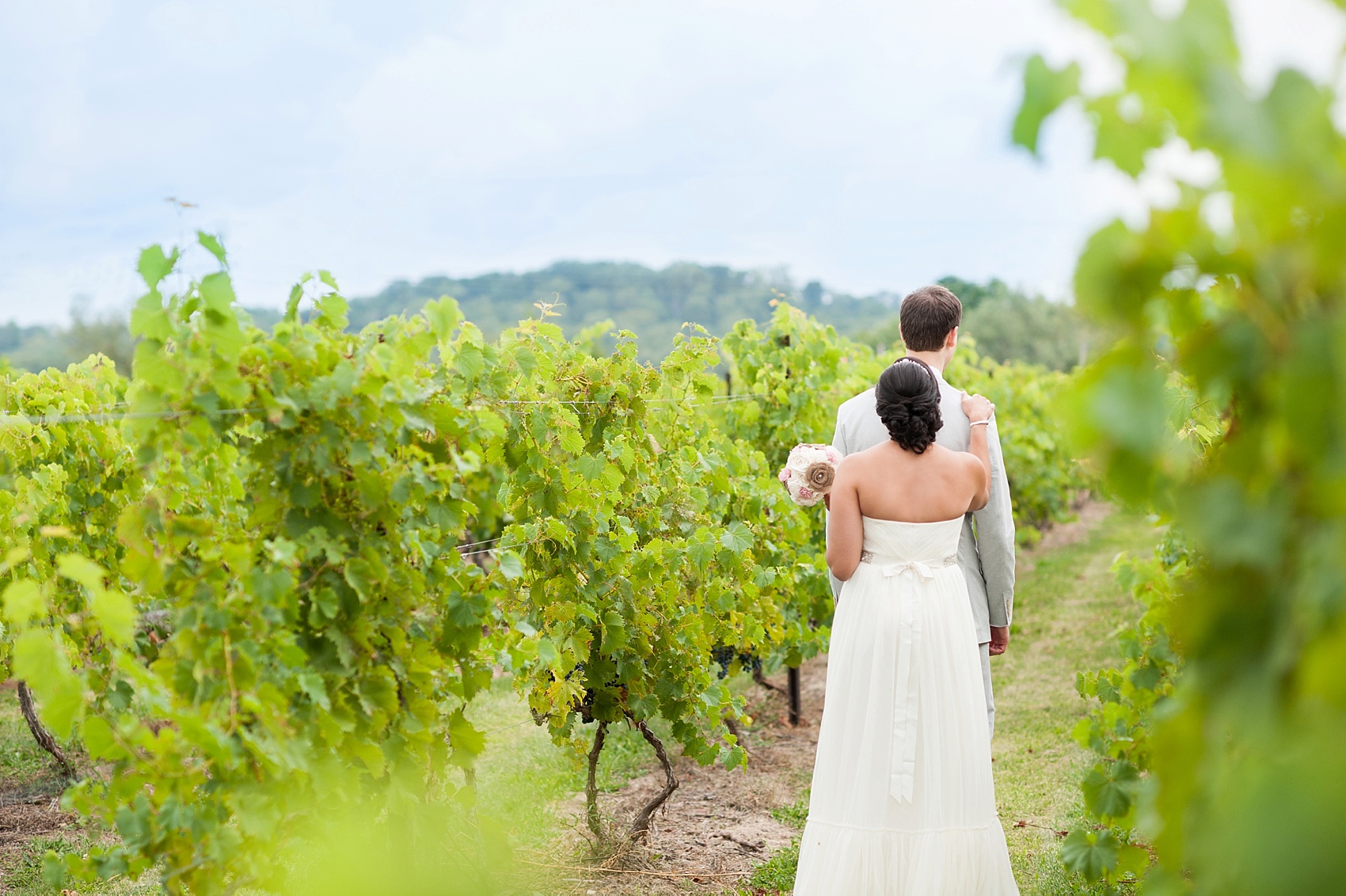 First look photos for a summer vineyard wedding at Hopewell Valley Vineyards. Photos by New Jersey wedding photographer, Mikkel Paige Photography.