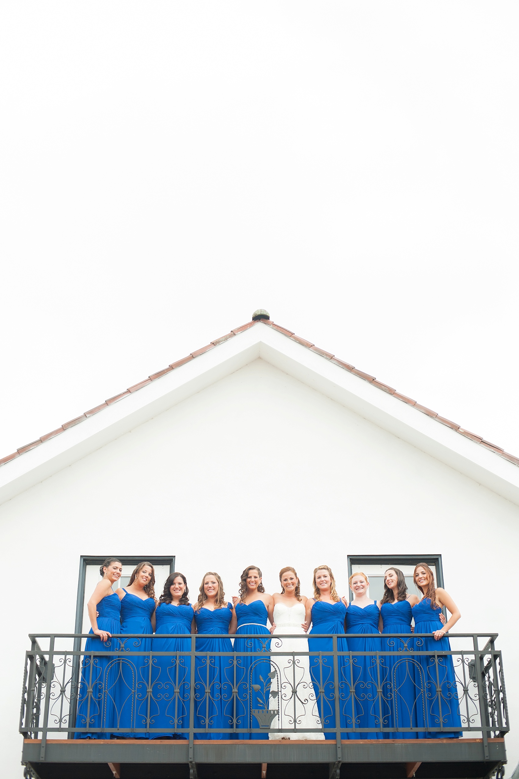 Perona Farms wedding photos of blue gown bridesmaids for a rustic colorful summer celebration. Pictures by New Jersey photographer Mikkel Paige Photography.