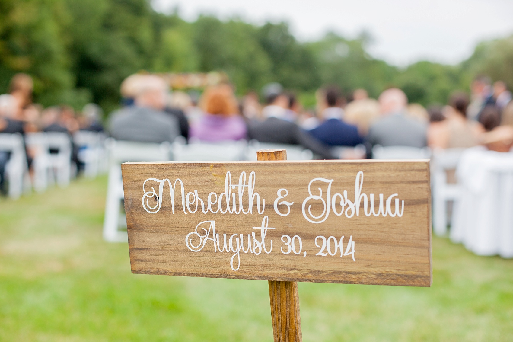 Perona Farms wedding photos wooden signage for a colorful rustic summer celebration. Pictures by New Jersey photographer Mikkel Paige Photography.