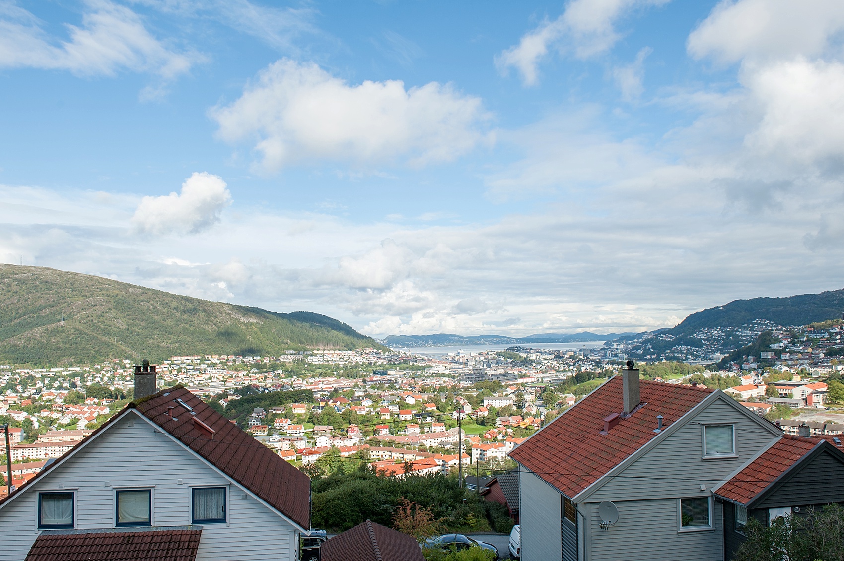 Bergen, Norway aerial view from a mountain. Bride prepares for her wedding day. Photos by Mikkel Paige Photography.