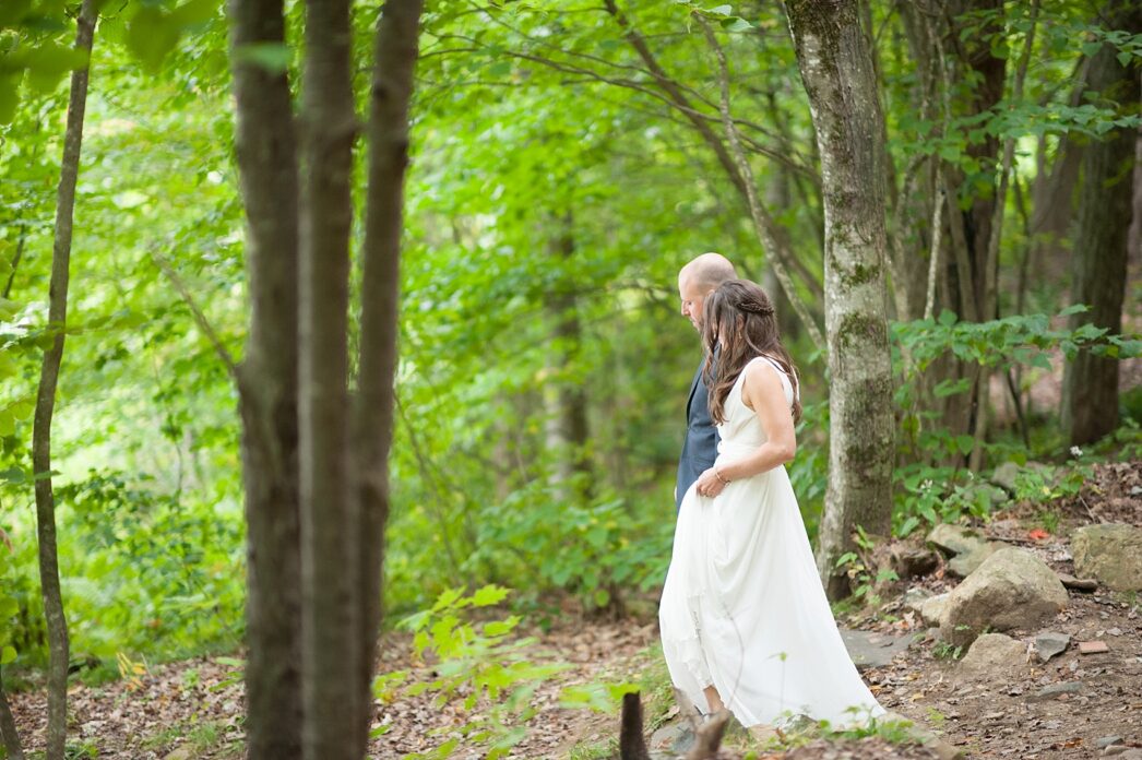 Bride and groom forest photos at their rustic Massachusetts Berkshires wedding at Camp Wa Wa Segowea. Photos by Mikkel Paige Photography, destination wedding photographer.