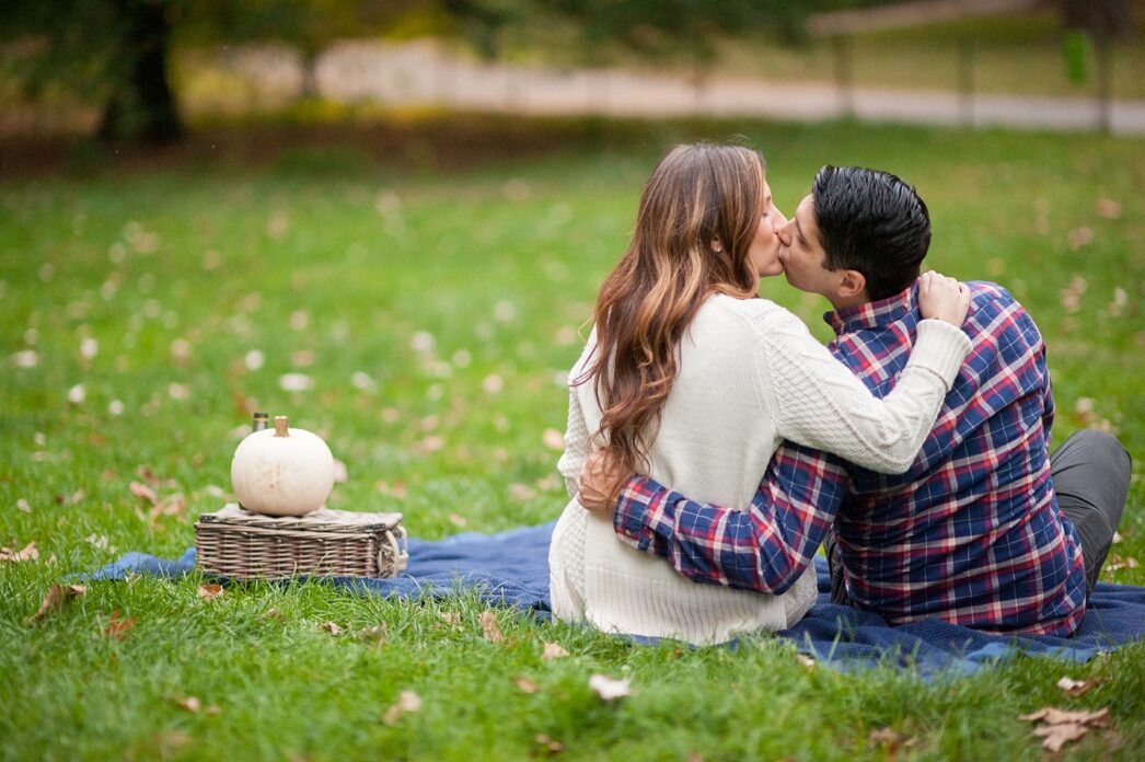 Central Park engagement photos in the fall with a picnic. New York City wedding photographer, Mikkel Paige Photography.