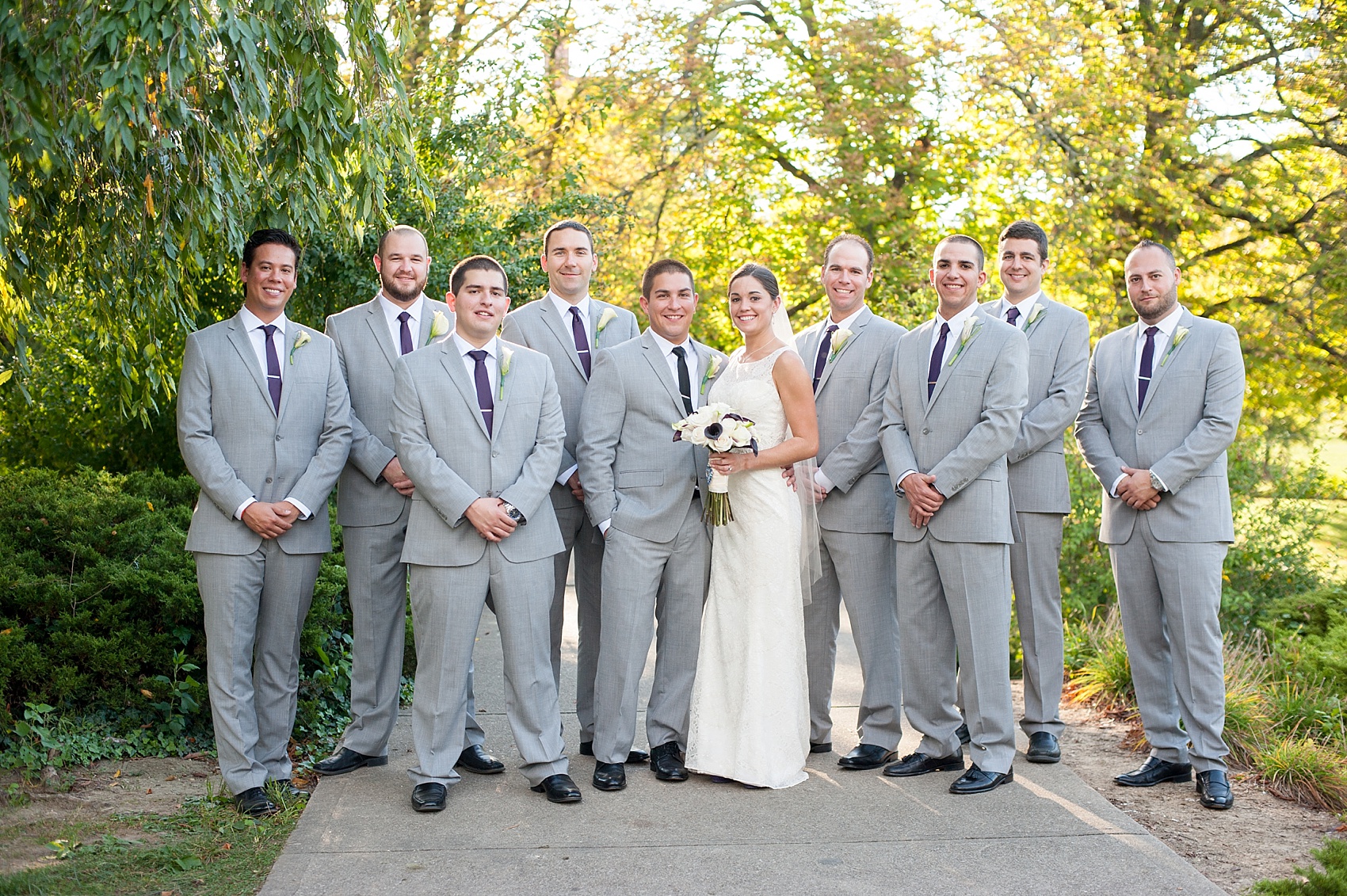 Groomsmen in grey suits at Eden Park for downtown Cincinnati, Ohio wedding at The Center. Photos by Mikkel Paige Photography.