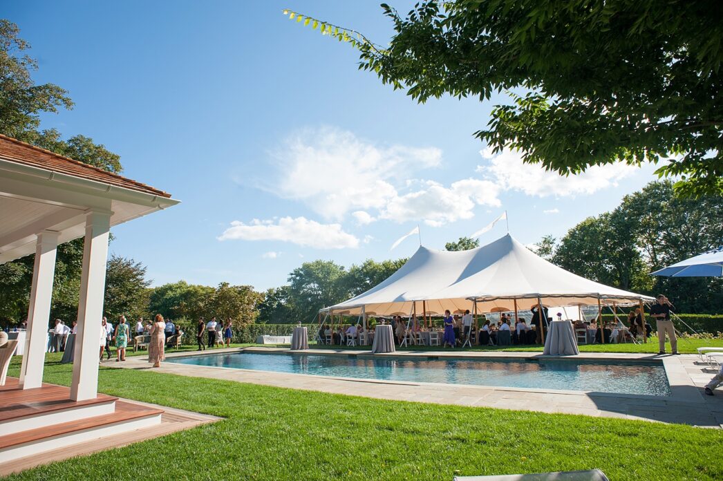 Same sex Hamptons wedding, tented on grass lawn. Photos by NYC photographer, Mikkel Paige Photography.