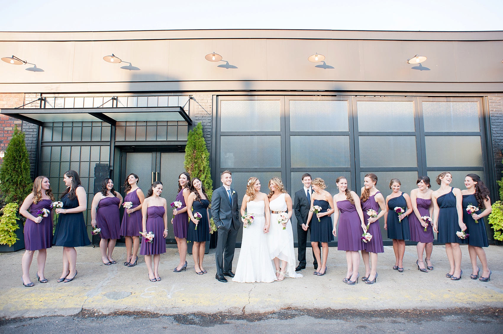 Flowers by Foxglove and Ann Taylor bridesmaids dresses in navy and purple for a lesbian wedding at 501 Union, Brooklyn, NY. Photography by Mikkel Paige, NYC wedding photographer.