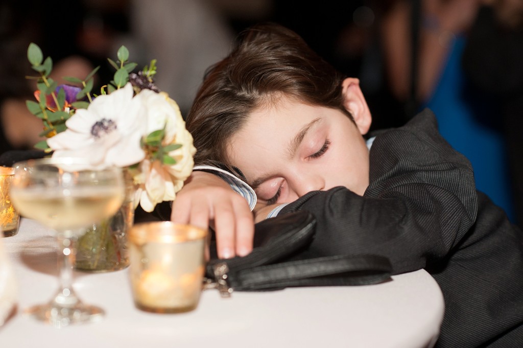 Sleepy guest at a gay, lesbian wedding at 501 Union, Brooklyn, NY. Photography by Mikkel Paige, NYC wedding photographer.