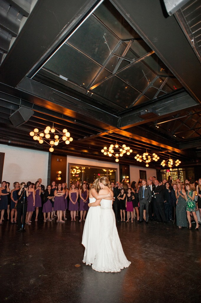 Dancing to the tunes from Scratch DJ, John Black, at a lesbian wedding at 501 Union, Brooklyn, NY. Photography by Mikkel Paige, NYC wedding photographer.