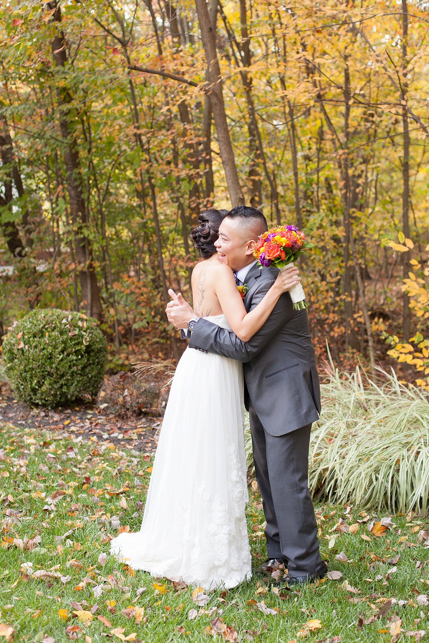 Surprise first look amongst fall foliage. Stonehouse at Stirling Ridge fall wedding photos, by Mikkel Paige Photography, New Jersey wedding photographer.