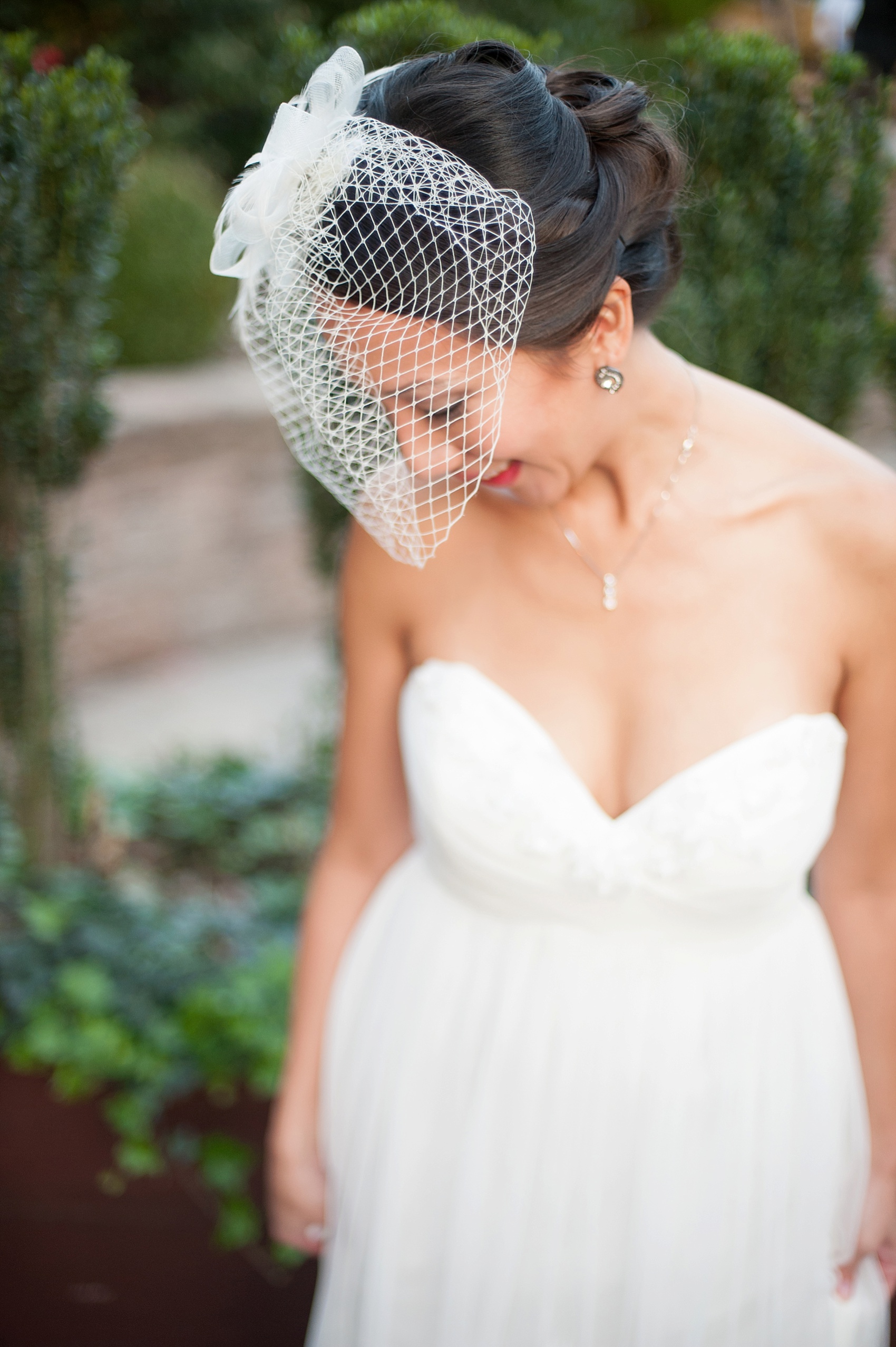 Bride wearing a bird cage veil for her wedding ceremony. Stonehouse at Stirling Ridge fall wedding. Photos by Mikkel Paige Photography, New Jersey wedding photographer.