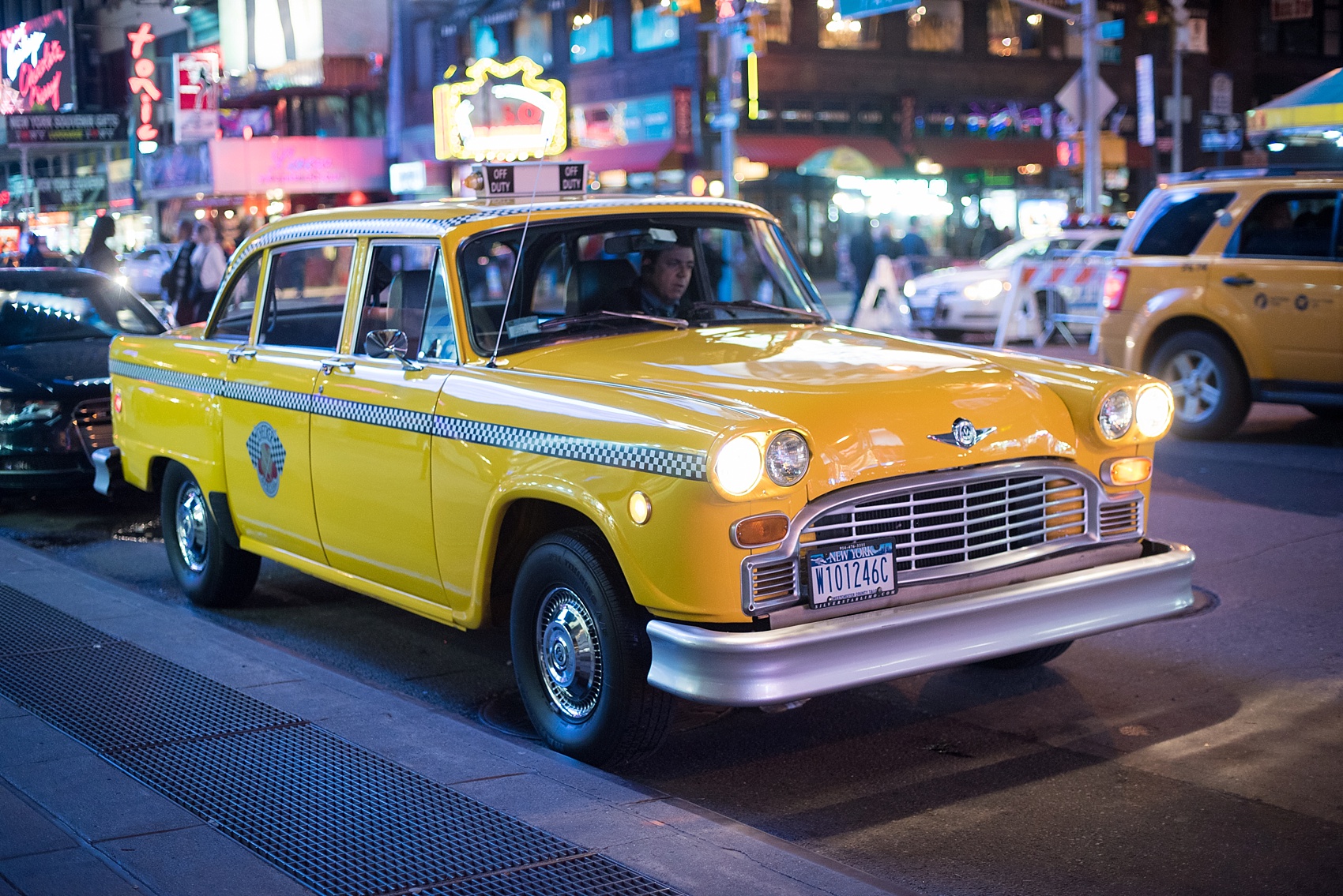Vintage taxi to take a couple to their NYC Times Square proposal. Photos by Mikkel Paige Photography. At the R Lounge, Renaissance Hotel, New York. 