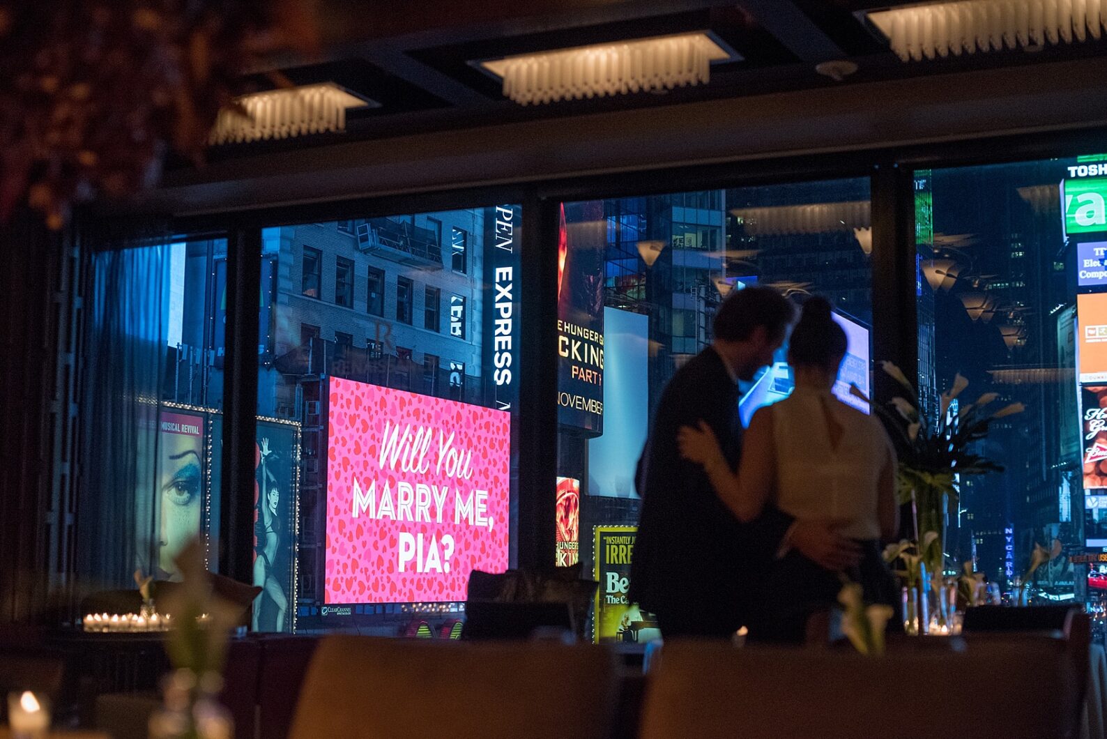 NYC Times Square proposal at the R Lounge with billboard "Will You Marry Me?" Photos by Mikkel Paige Photography.