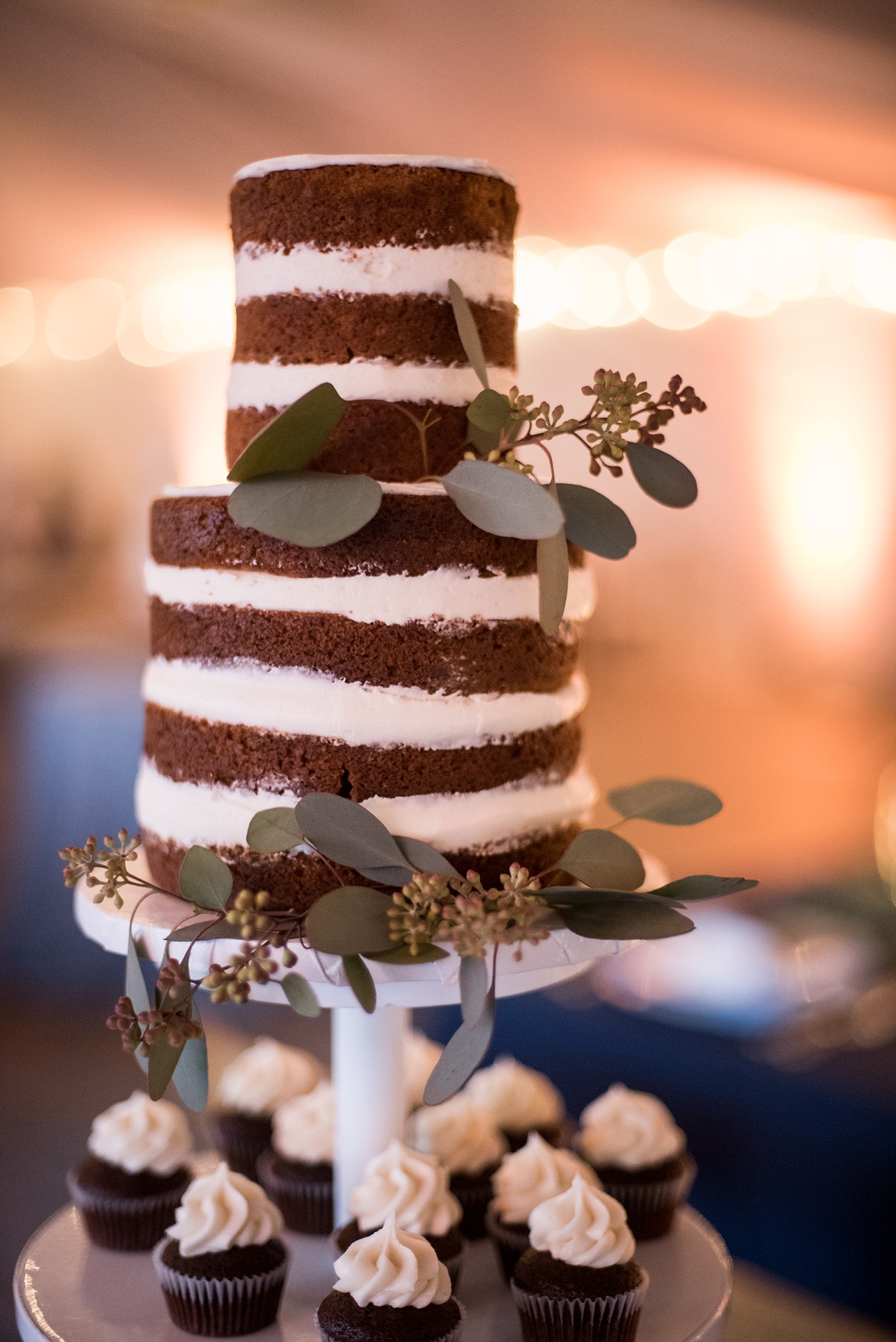 Raleigh North Carolina wedding photographer Mikkel Paige visits Merrimon-Wynne bridal event, featuring cake design by Cupcake Shoppe and Simply Elegant Floral Design. 
