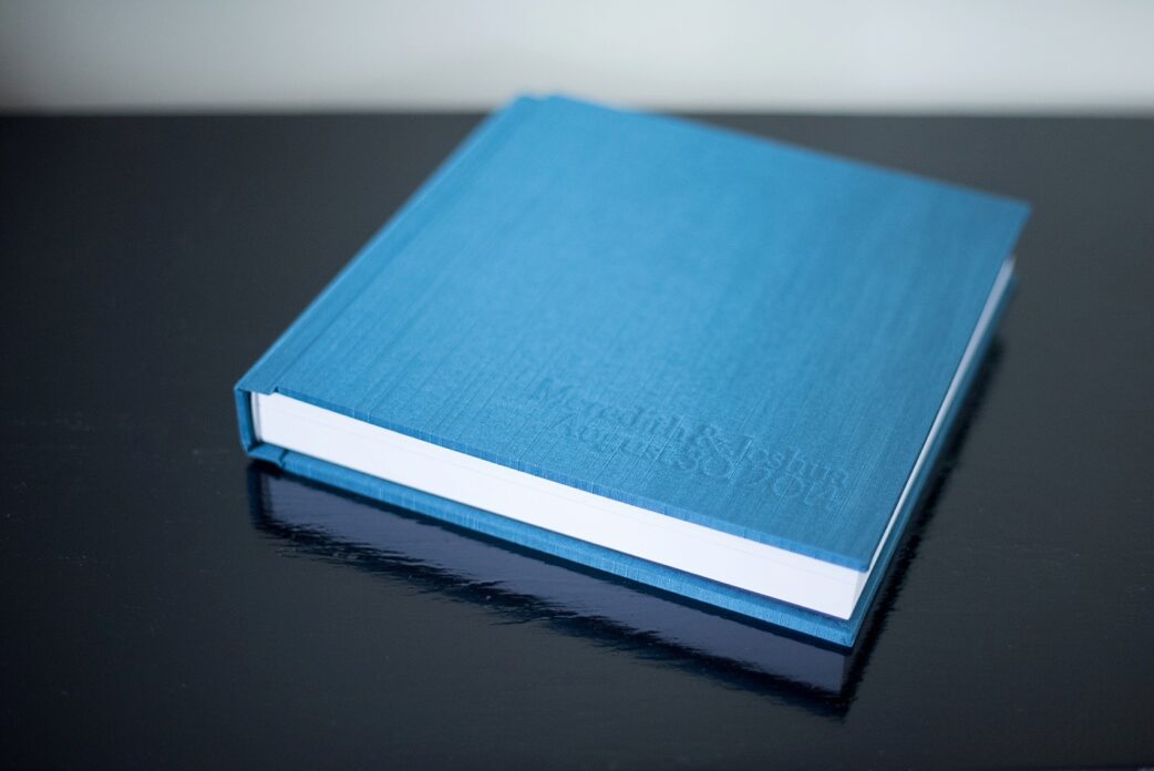 Wedding photo album heirloom keepsake. Blue raw silk, photos by Mikkel Paige, Raleigh wedding photographer.