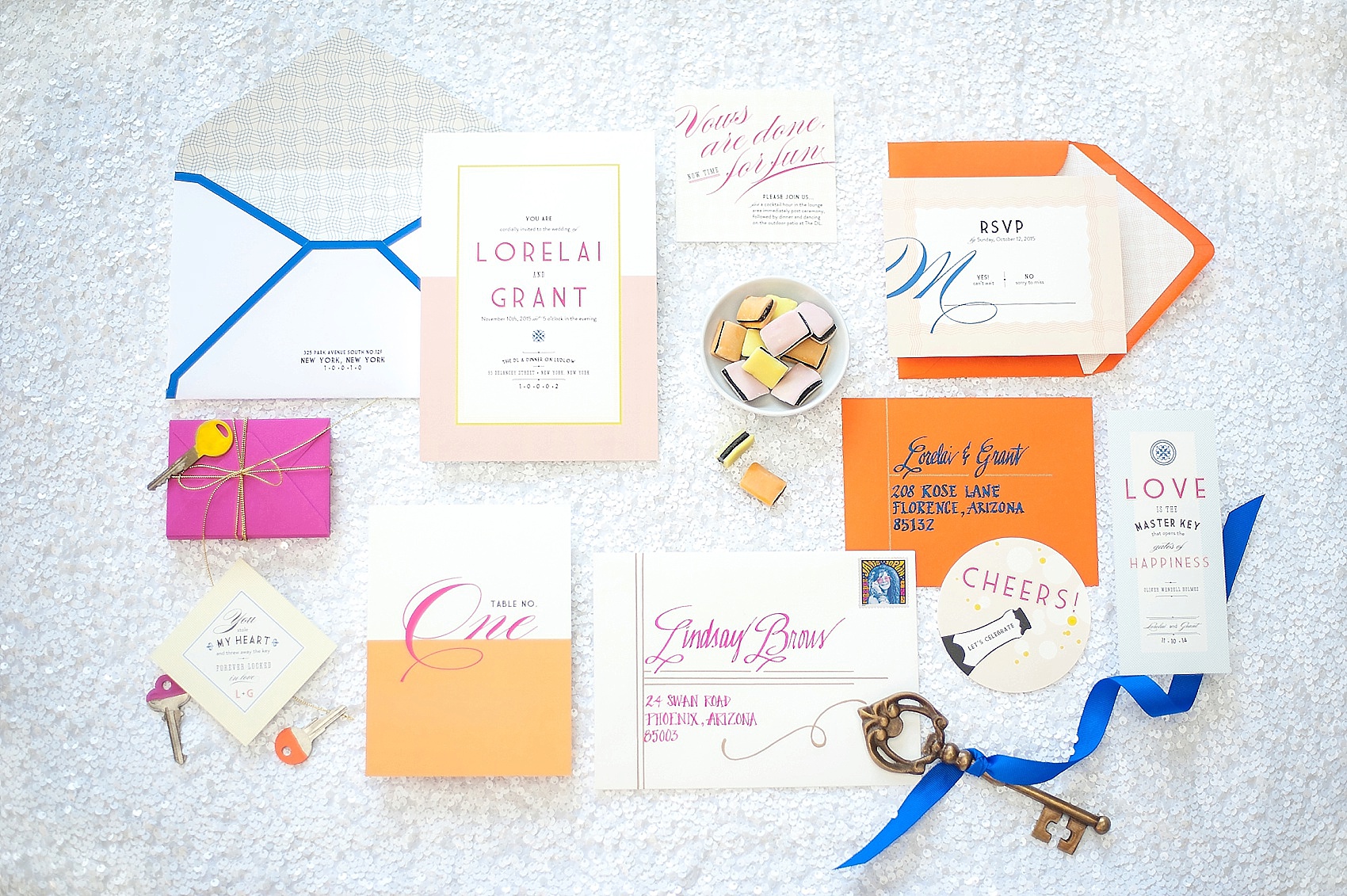 Wedding invitations and paper suites by Raleigh wedding photographer, Mikkel Paige. Paper suites, stamps, calligraphy and more. Orange, cobalt blue and hot pink for a Love Locks inspired wedding.