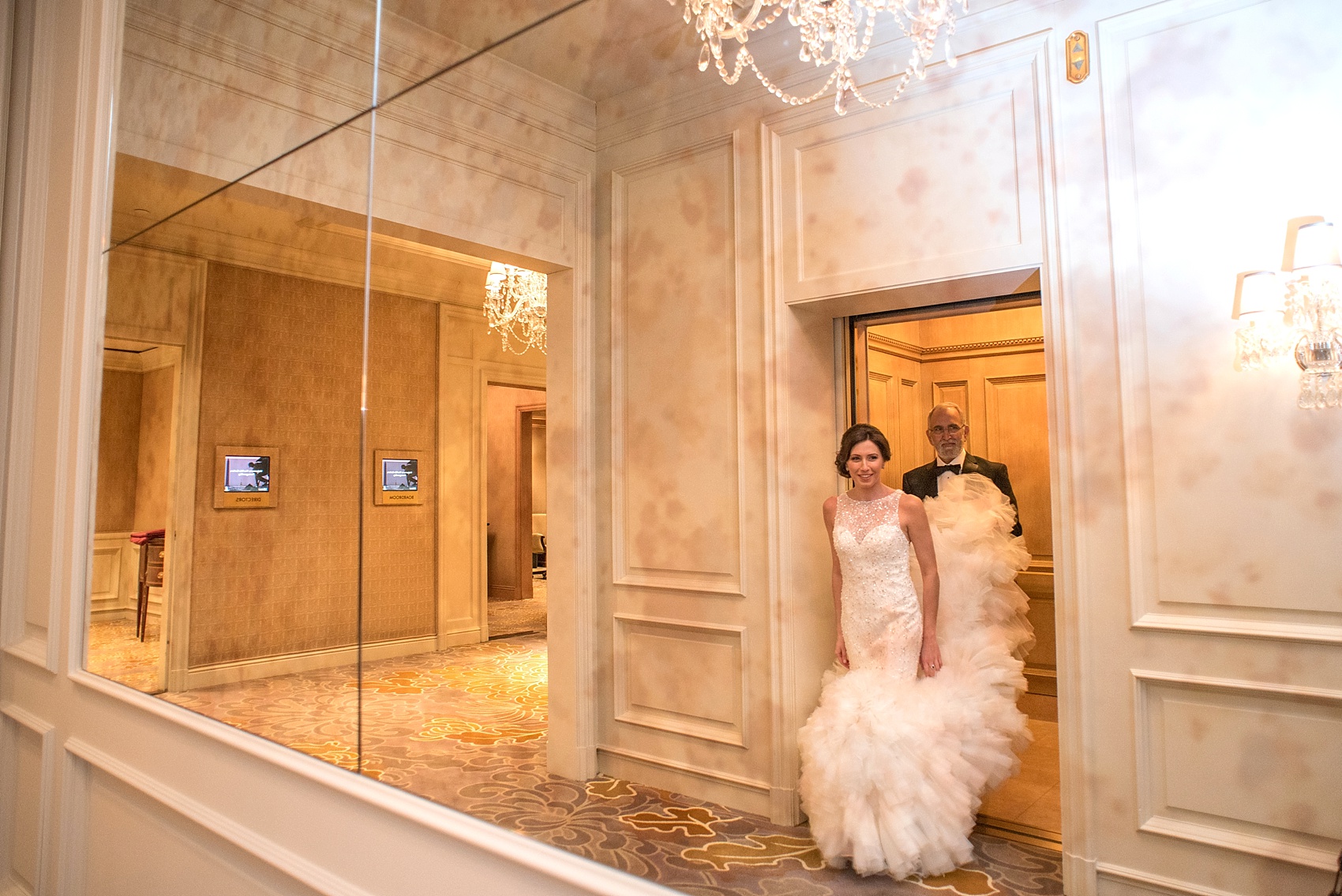 Washington, DC wedding photos by Mikkel Paige. The bride and her father walk to her first look at The Ritz Carlton, Pentagon City.