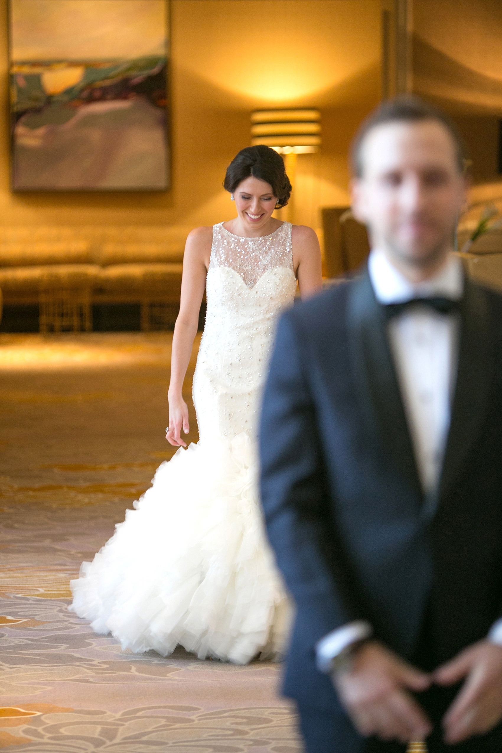 Washington, DC wedding photos by Mikkel Paige. The bride walk up to her groom for their first look at The Ritz Carlton, Pentagon City.