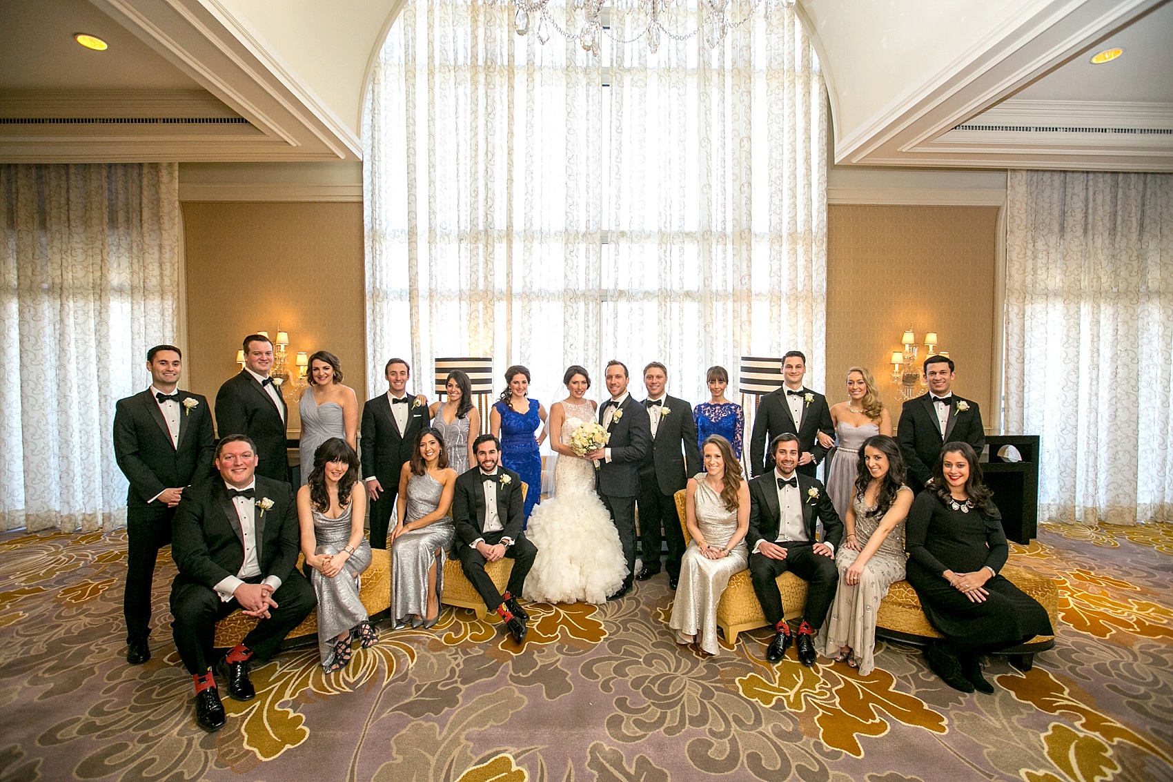 Washington, DC wedding photos by Mikkel Paige. The wedding party poses for a photo at The Ritz Carlton, Pentagon City.