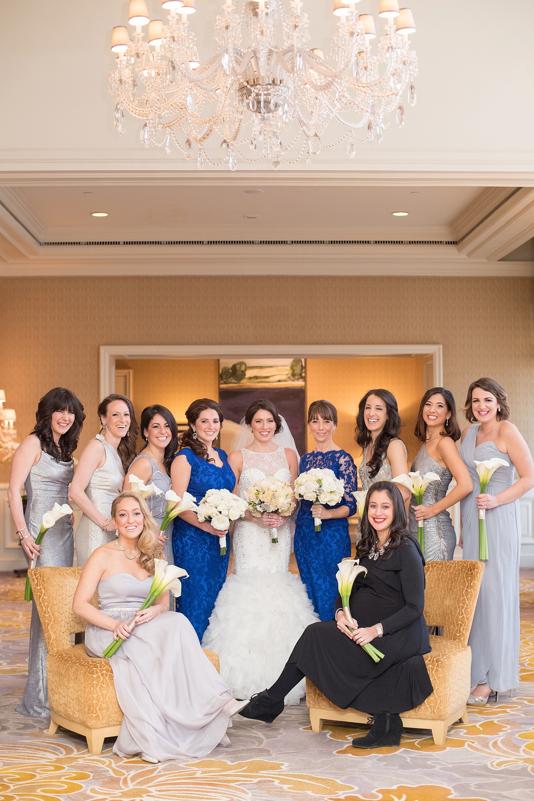 Washington, DC wedding photos by Mikkel Paige. The wedding party poses for a photo at The Ritz Carlton, Pentagon City.