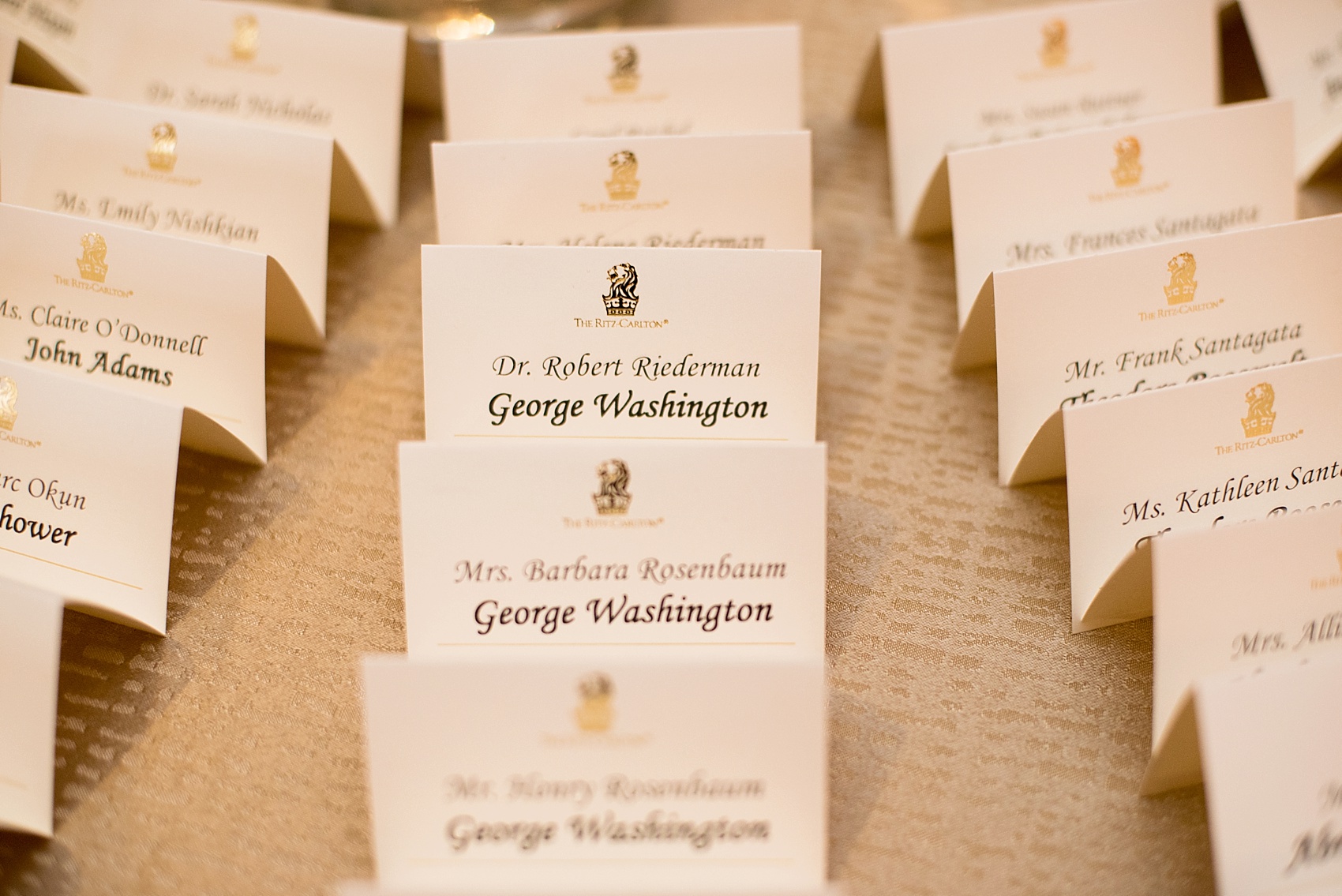 Washington, DC wedding photos by Mikkel Paige. Escort cards were labeled with presidents names for table at the Ritz Carlton, Pentagon City.