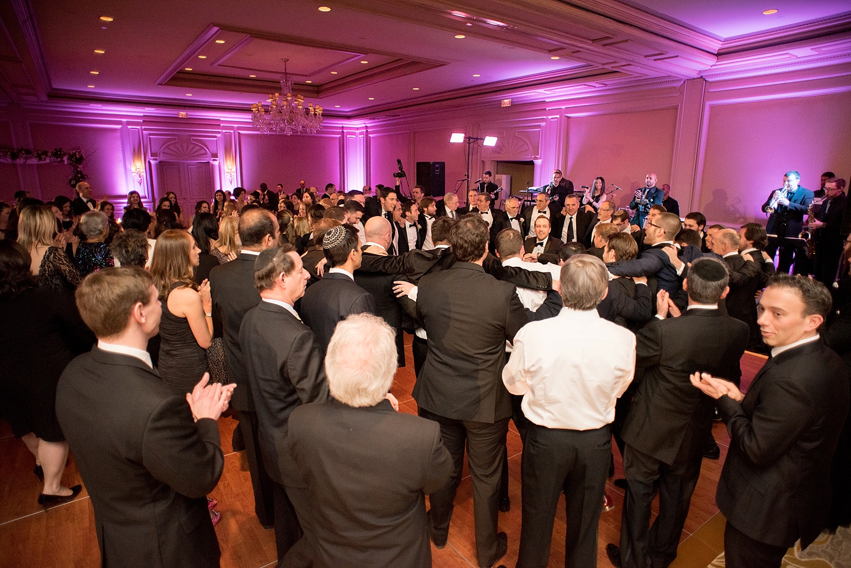 Washington, DC wedding photos by Mikkel Paige. The guests dance the horah at the Ritz Carlton, Pentagon City.