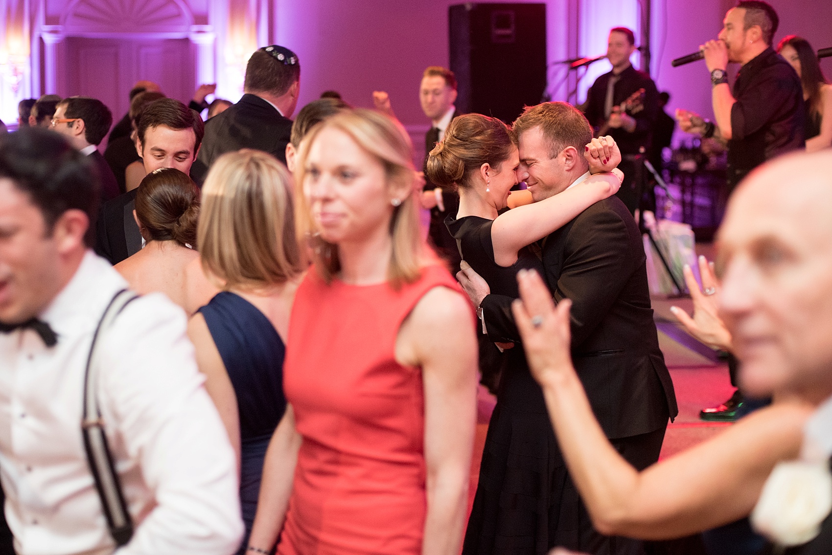 Washington, DC wedding photos by Mikkel Paige. Wedding guest on the dance floor at the Ritz Carlton, Pentagon City.
