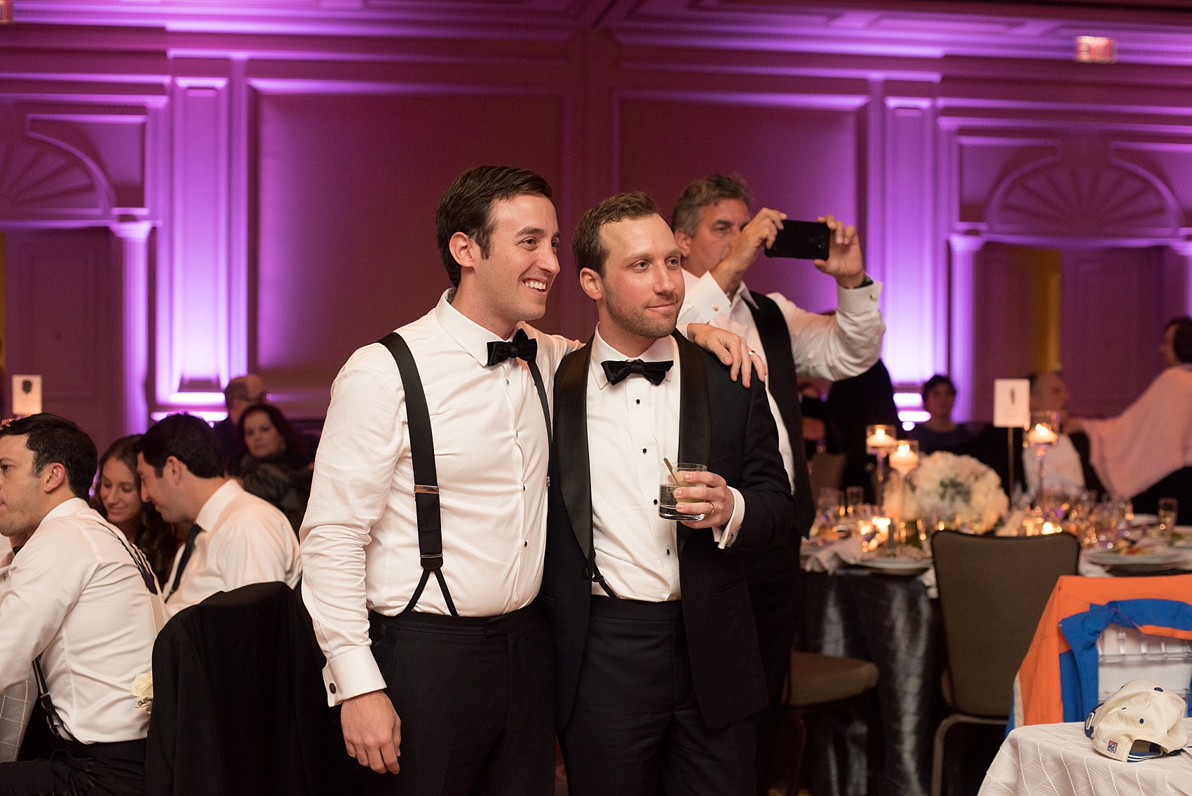 Washington, DC wedding photos by Mikkel Paige. The groom and his best friend share a moment at The Ritz Carlton, Pentagon City.