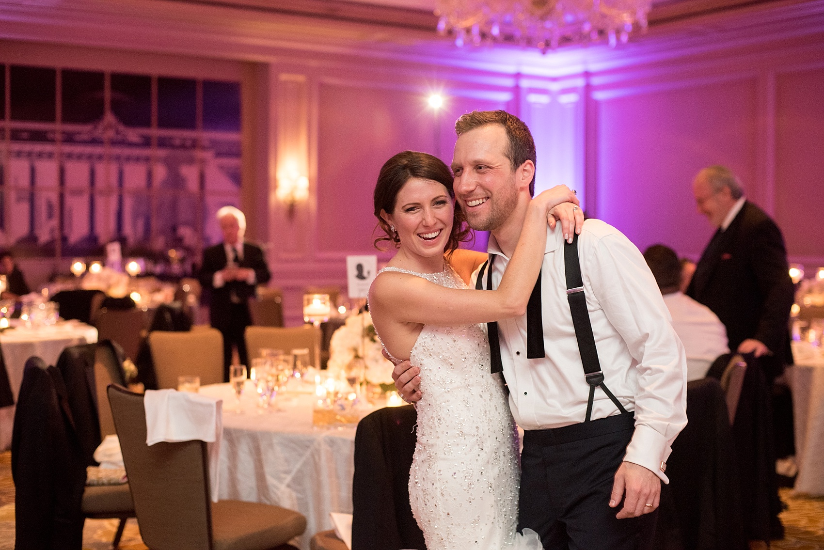 Washington, DC wedding photos by Mikkel Paige. The bride and groom share a last embrace at the Ritz Carlton, Pentagon City.