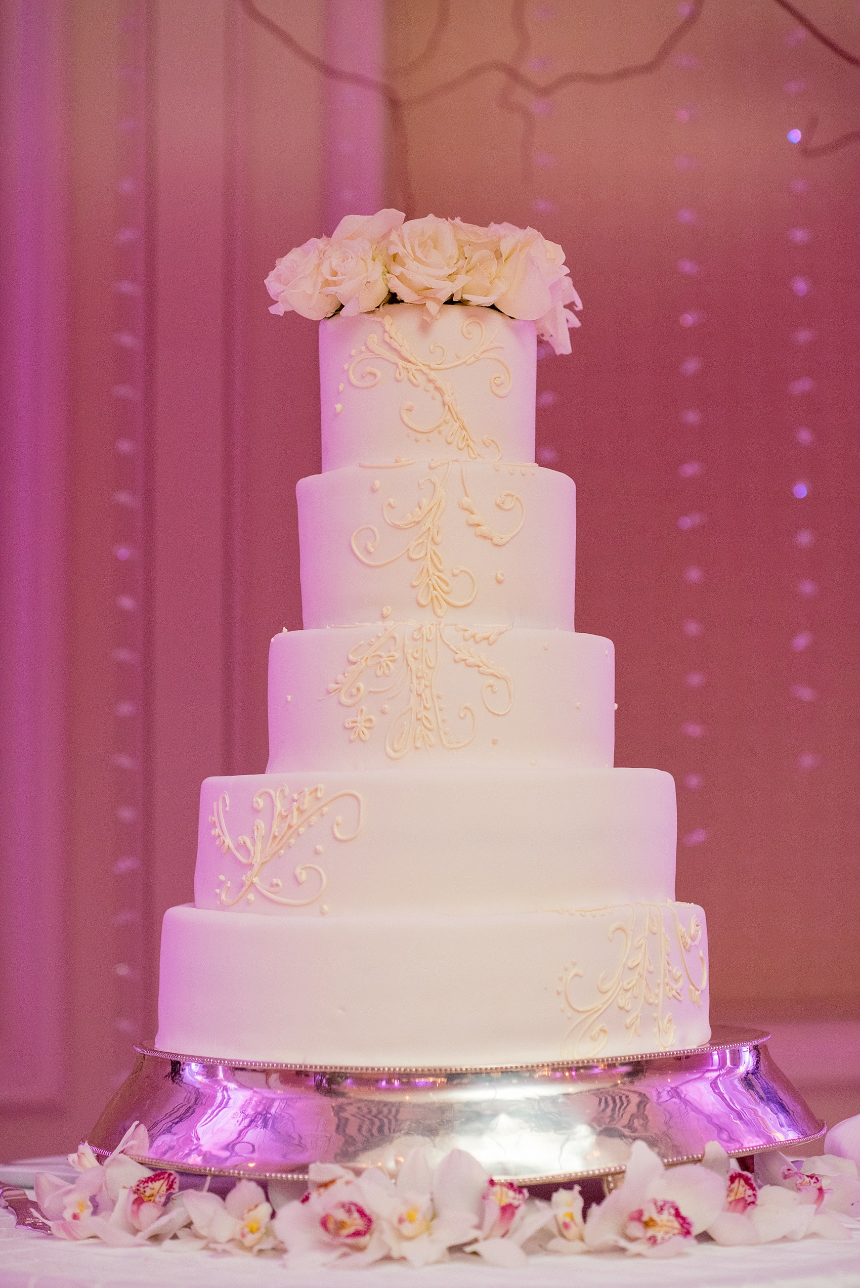 Washington, DC wedding photos by Mikkel Paige. Their cake was an all white 5 tier cake with swirl piping at the Ritz Carlton, Pentagon City.