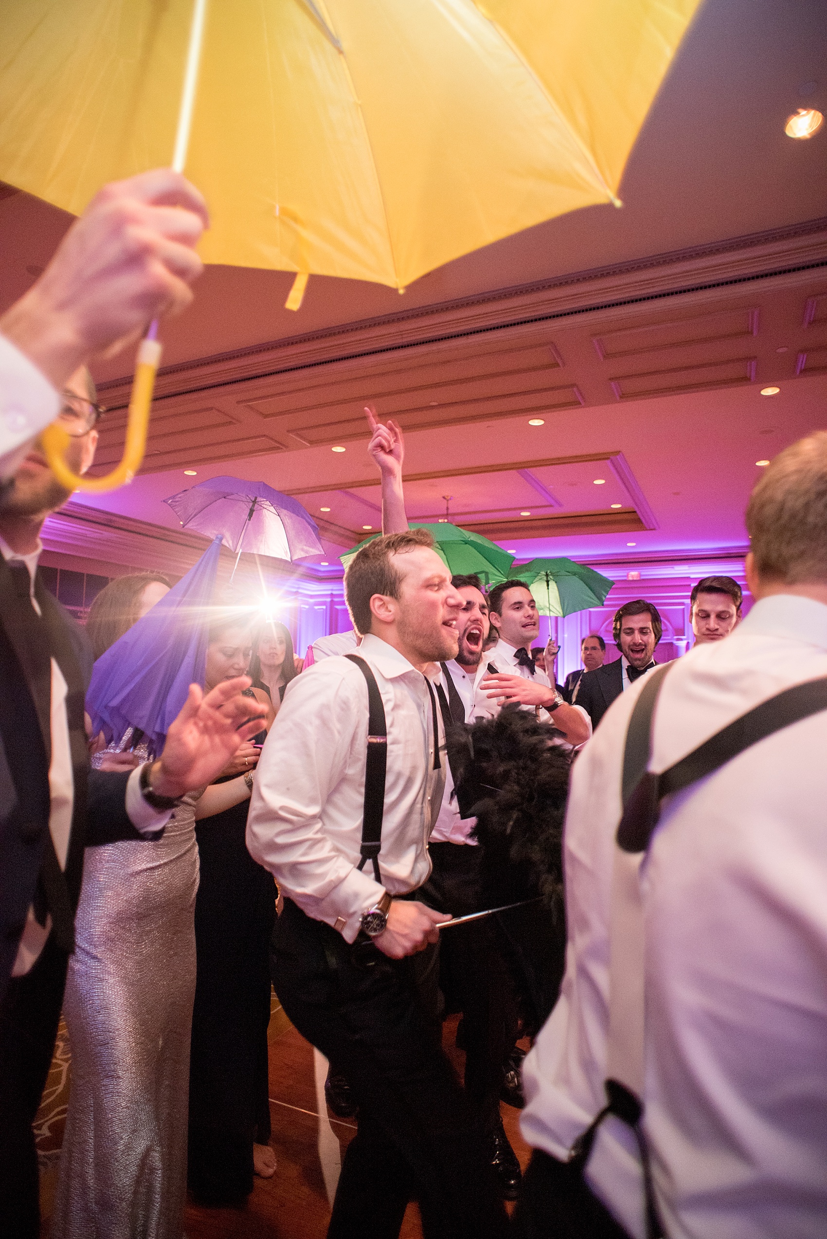 Washington, DC wedding photos by Mikkel Paige. The bride surprised the groom with a New Orleans style Second Line at the Ritz Carlton, Pentagon City.