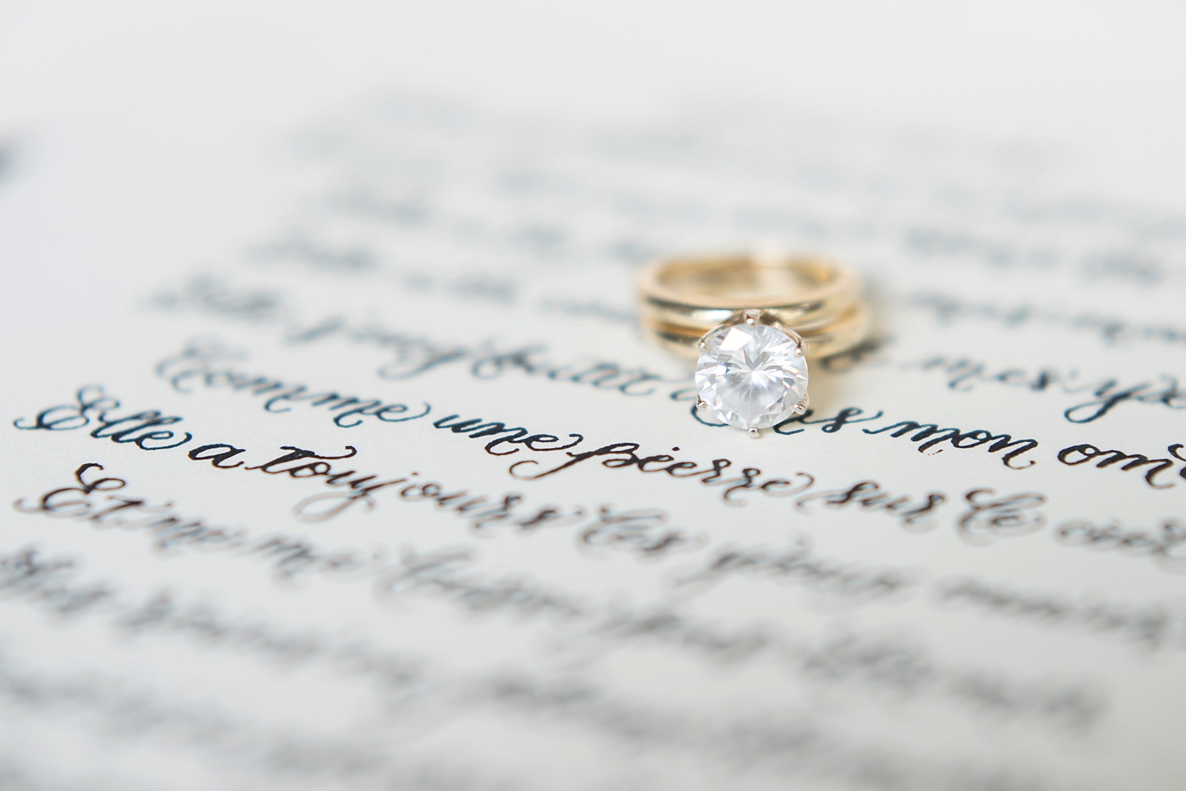 Destination wedding photographer Mikkel Paige captures a glamorous industrial bridal session in Hawaii with Burnett's Boards and Moana Events. Hand calligraphy poem and simple engagement ring.